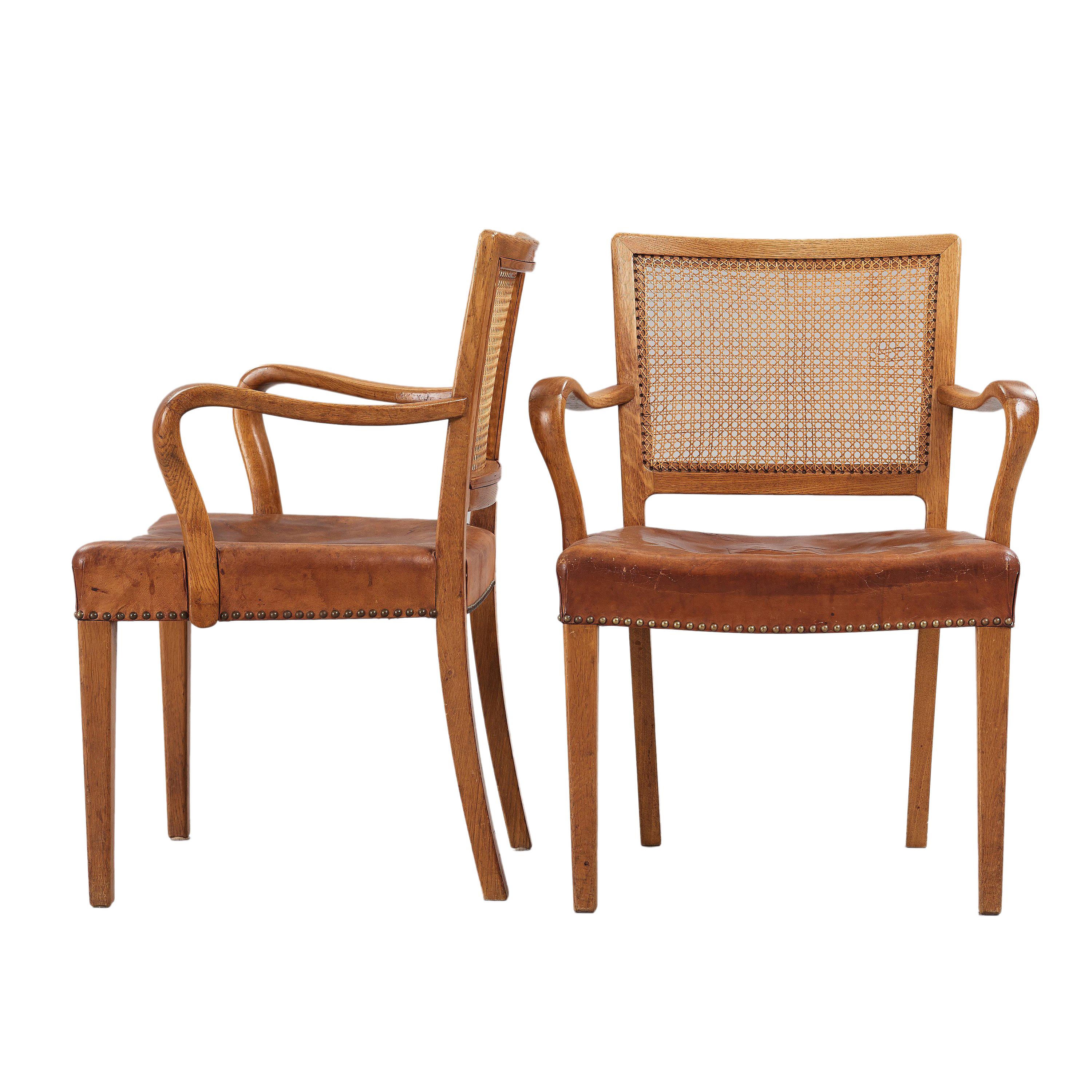 Set of 12 Erik Wørts dining chairs in solid oak, backrests in cane and seats in original Niger leather for cabinetmaker Henrik Wørts Møbelsnedkeri. The set consists of 10 side chairs and 2 armchairs. Designed 1945.

Litterature:
40 years of