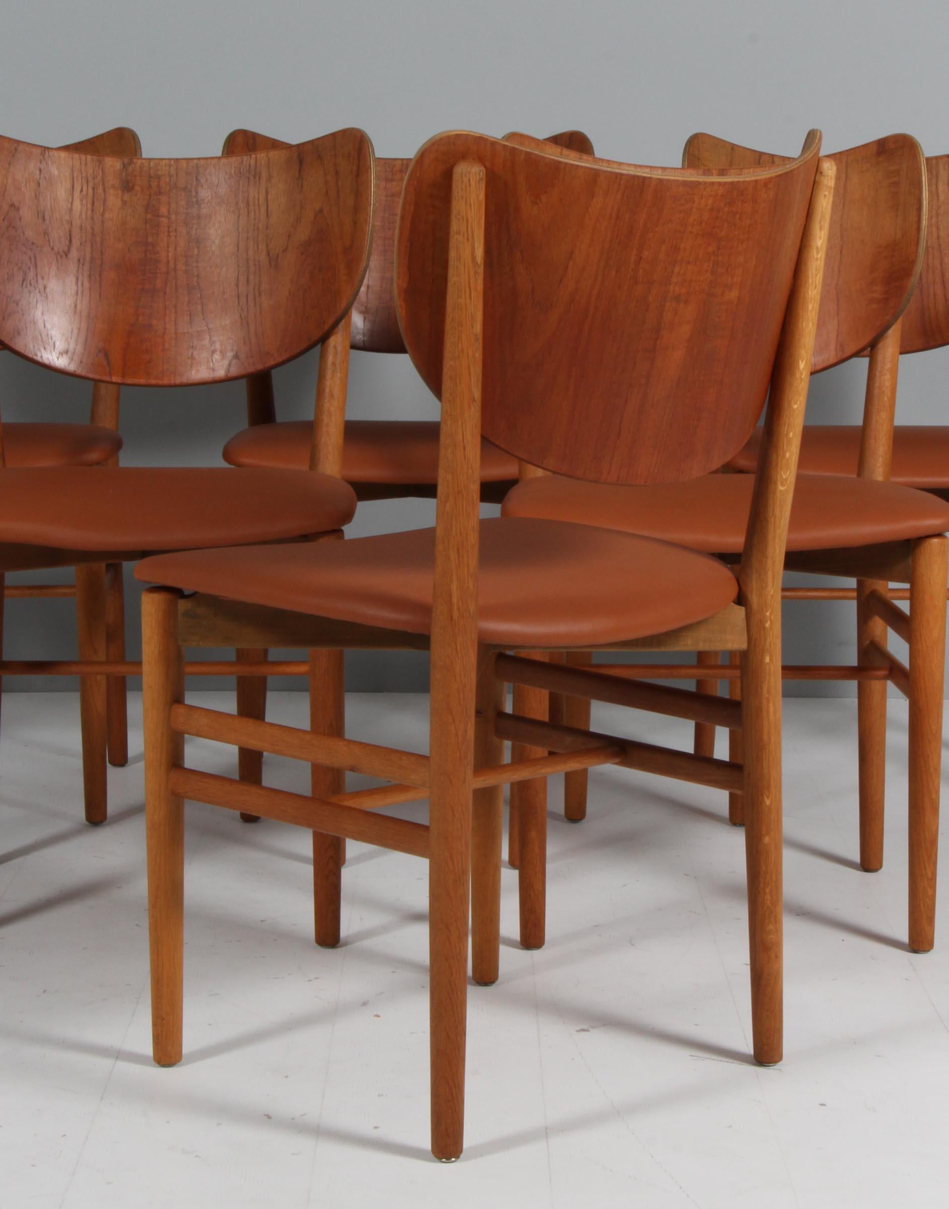 Leather Erik Wørts set of six dining chairs, teak and oak. Denmark 1950s