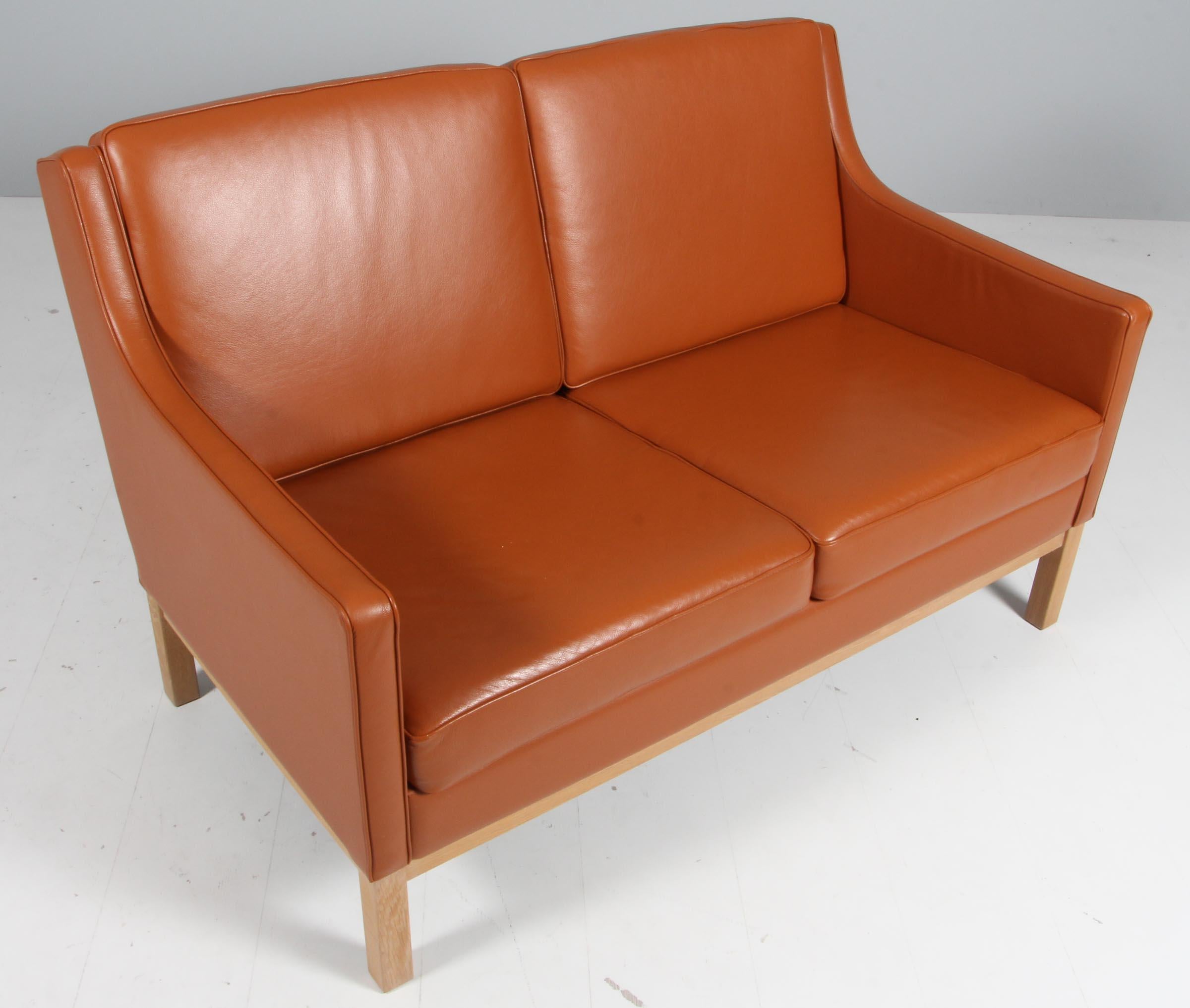 Scandinavian Modern Erik Wørts two seat sofa, cognac leather, oak, Denmark For Sale