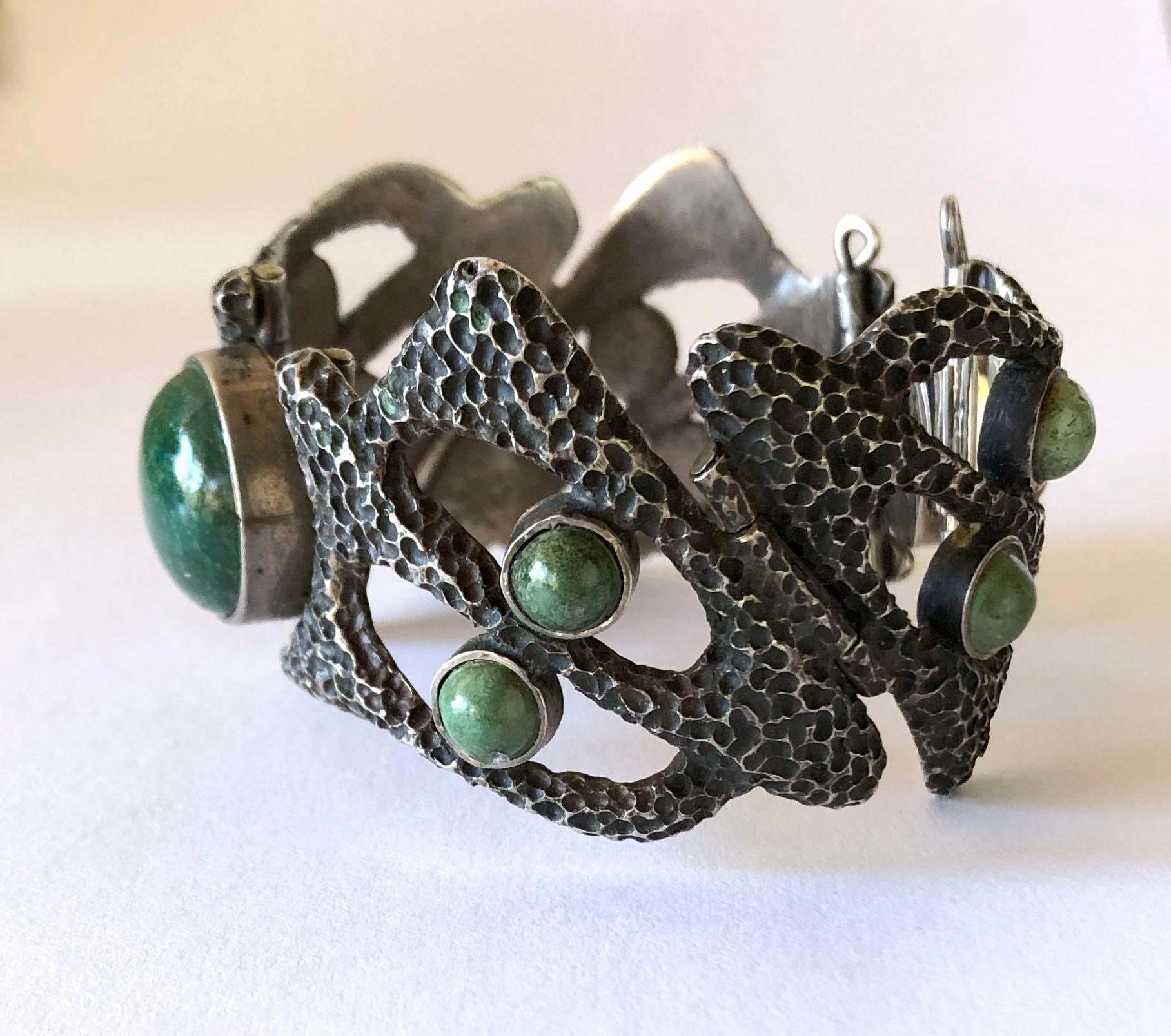 Heavily textured sterling silver and with natural gemstones bracelet created by Erika Hult de Corral of Puerto Vallarta, Mexico. Bracelet has a wearable wrist measurement of 6.5