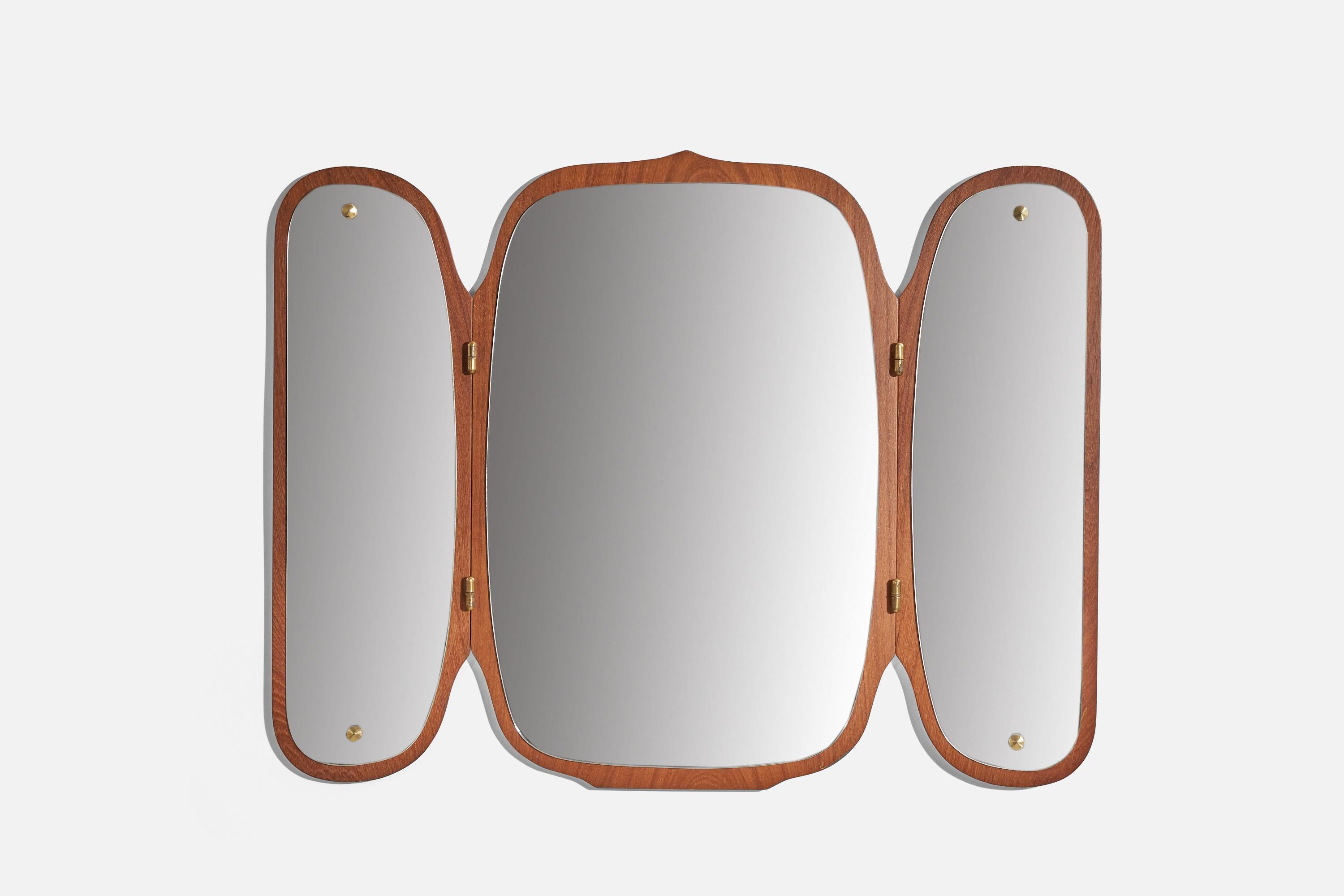 An adjustable teak wall mirror designed and produced by Eriksmålaglas, Eriksmåla, Sweden, 1950s. 
Executed in three joined parts that are adjustable.

