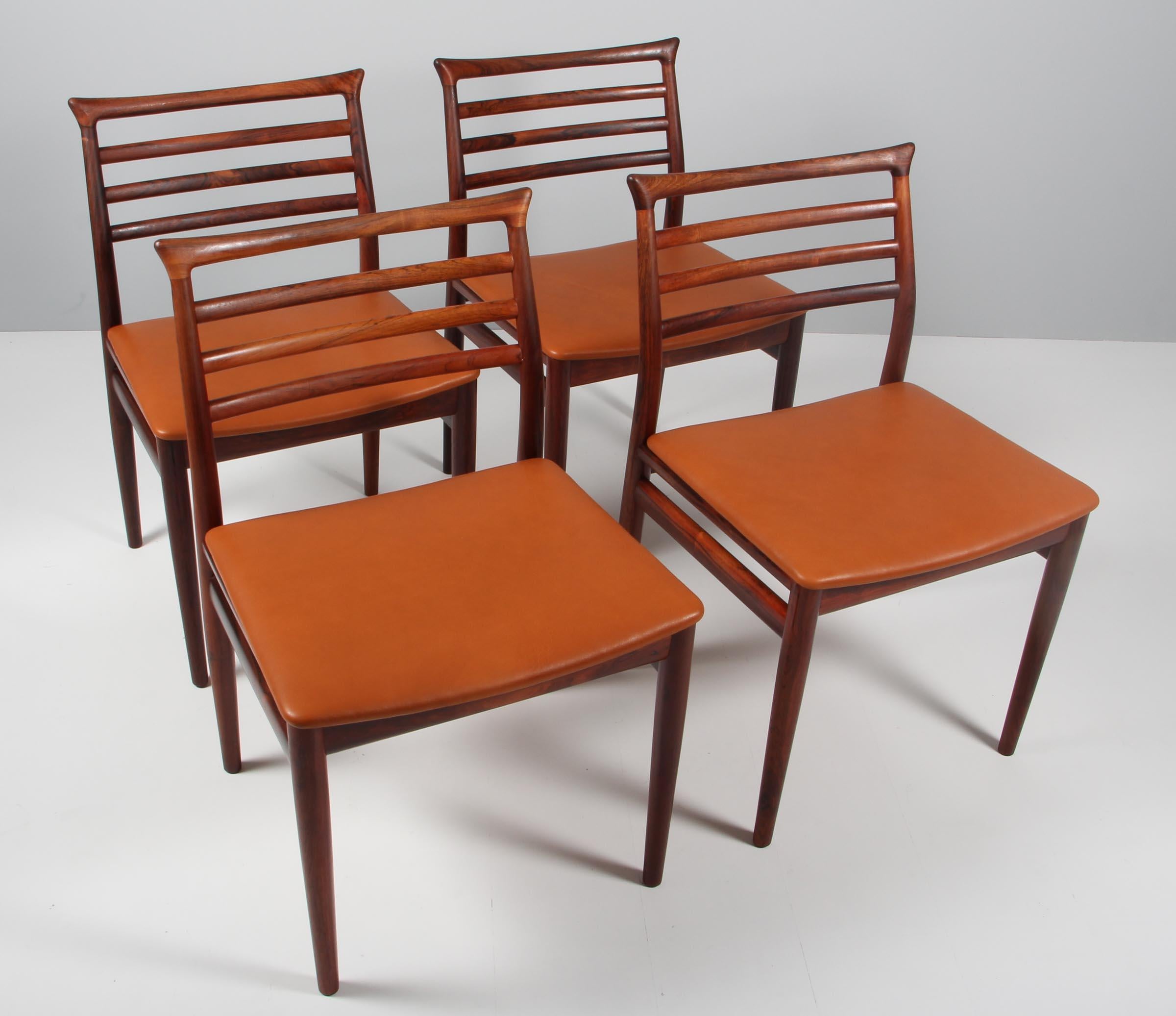 Erling Torvits set of four dining chairs in rosewood. New upholstered with tan aniline leather.

Made by Sorø Stolefabrik.