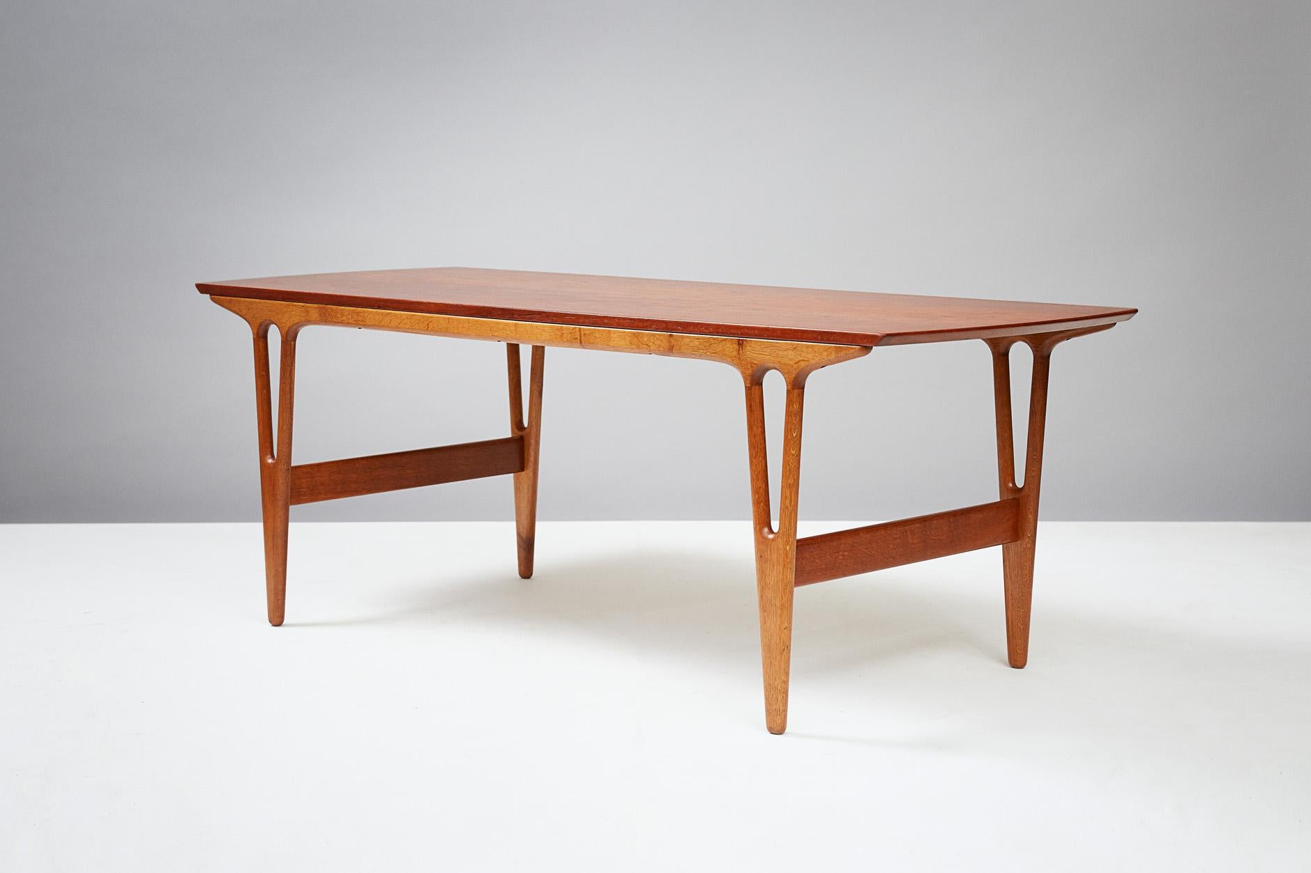 Erling Torvits

Model 25 table, circa 1960

Produced by Heltborg Mobler, Denmark. Y-shaped oak legs with solid teak top. 

