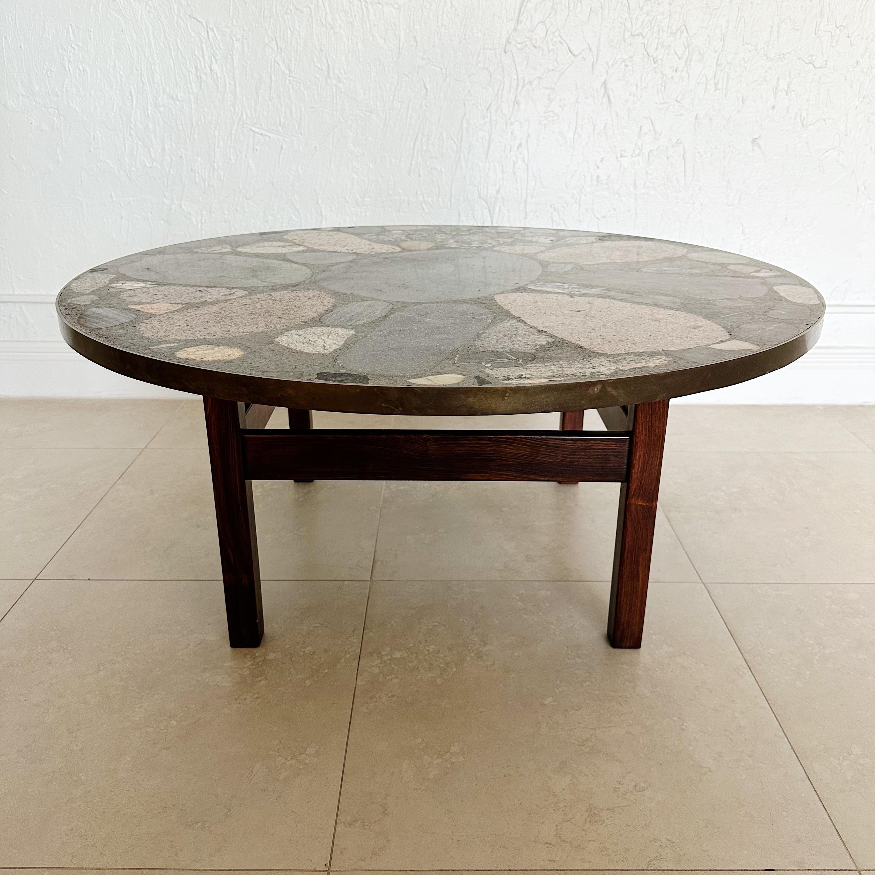 Erling Viksjø was a Norwegian architect and designer best known for his Brutalist architecture and furniture using concrete and stones. This unique circular terrazzo coffee table from the 1960