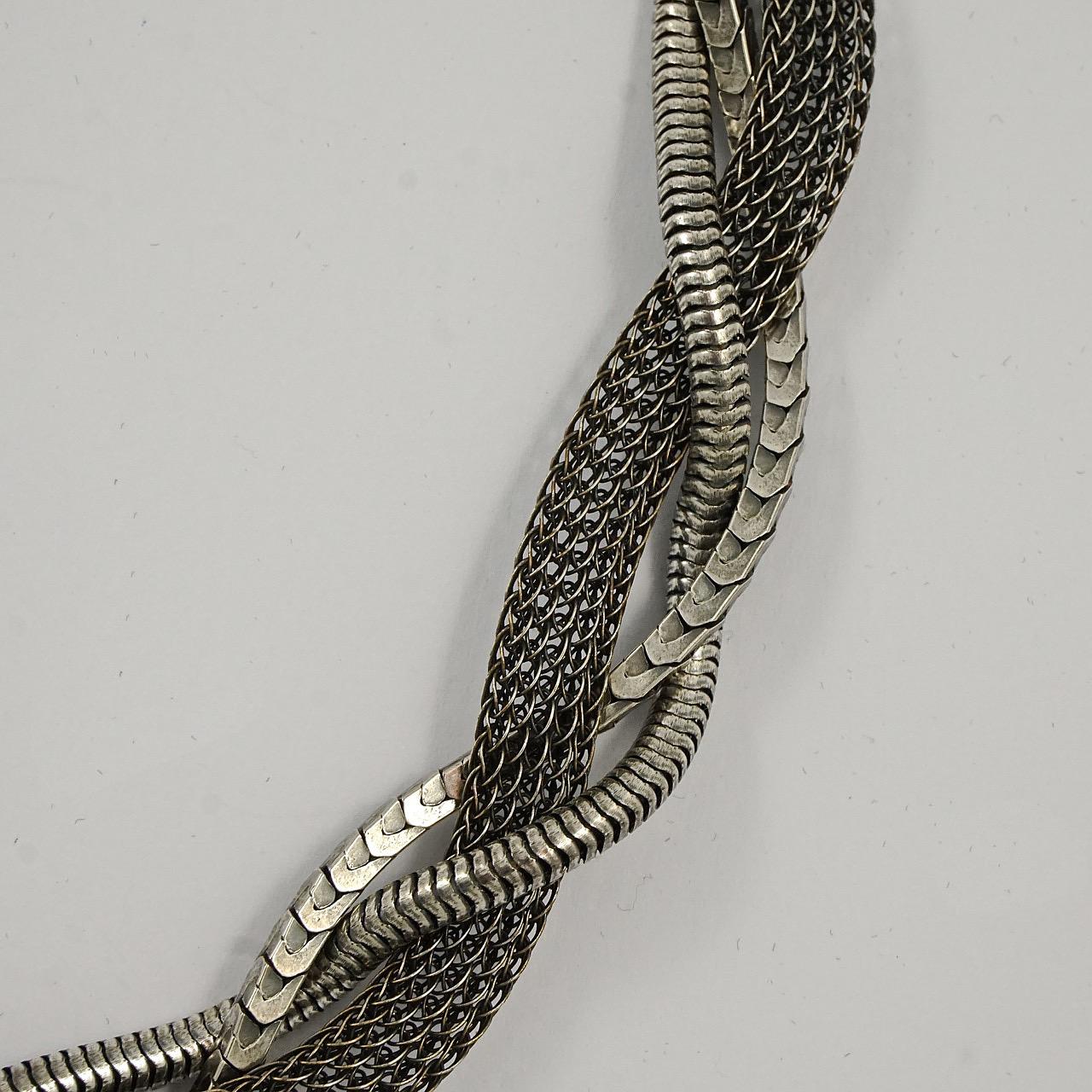 Ermani Bulatti antiqued silver tone necklace, with three chains woven through each other, in mesh, snake and an unusual box chain design. It has a large ring bolt clasp. The necklace is length 42cm / 16.5 inches with an extension of 11cm / 4.3