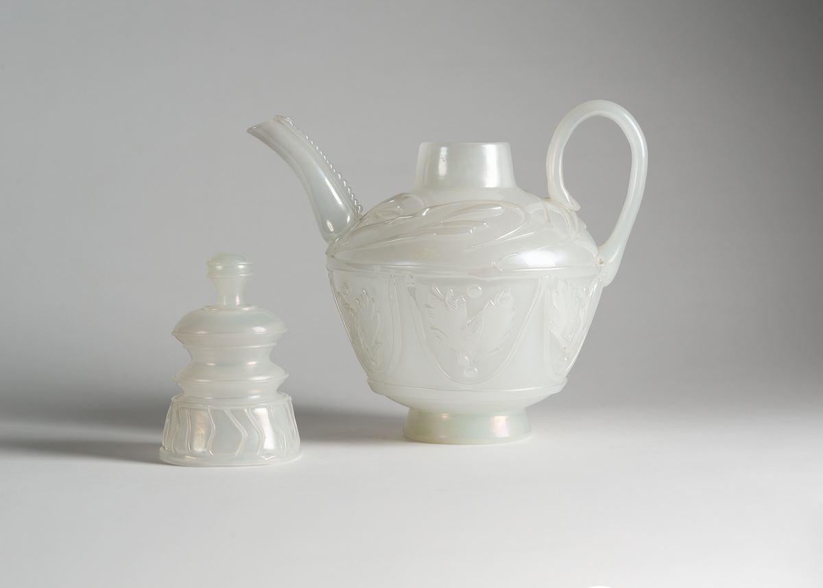 Provenance:
Archive of Cenedese glassworks, Murano, Italy.

Ermanno Nason designed this beautiful teapot for Vetreria Gino Cenedese in 1964. It is composed of a milky, opaque glass, adorned with oriental motifs, and is well-balanced and playful,