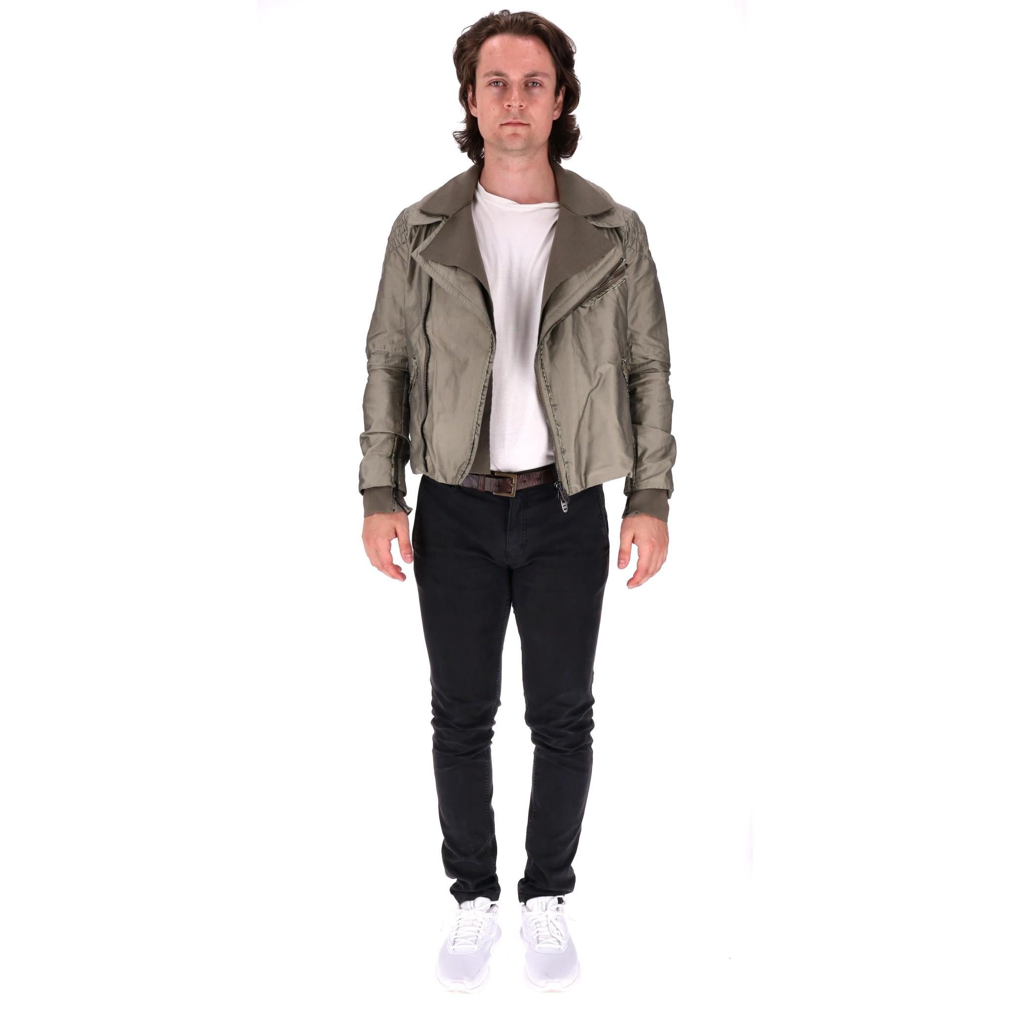 Ermanno Scervino Cotton Blend Biker Jacket

Khaki short jacket with distressed design detailed with tonal stitching.

Featuring ribbed collar and cuffs and zip closure along the side.

Having three zipped pockets to the front and zipped cuffs.

Size