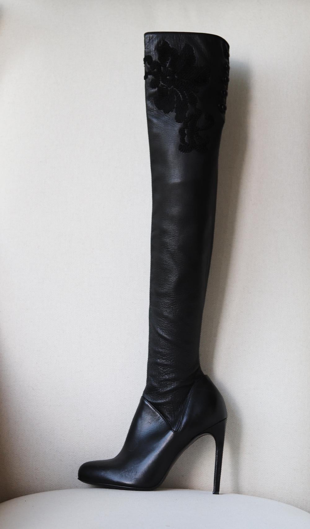 Made in Italy from soft stretch-leather, these boots are intricately designed with floral embroidery along the top along, this sculptural pair is your ticket to some daytime to evening glam. .
Black stretch leather.
Heel measures approximately 100