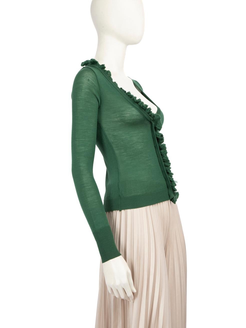 CONDITION is Good. General wear to knitwear is evident. Moderate signs of wear on the brand label, with stitching partially undone, and loose threads throughout the entire front ruffle on this used Ermanno Scervino designer resale