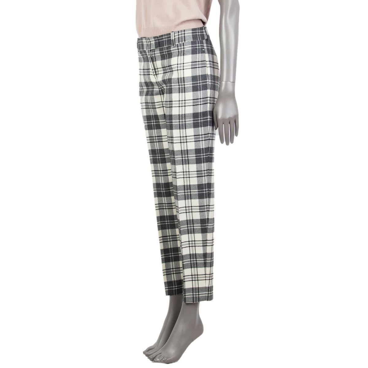 100% authentic Ermanno Scervino plaid wool pants in grey, charcoal and cream virgin wool (100%) with a mid-high waist, tapered leg, belt loops, side slit-pockets and back welt pocket. Unlined. Closes with a zipper, button, hook and bar in the front.