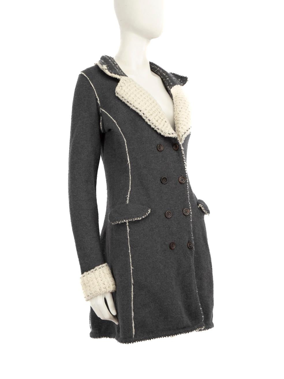 CONDITION is Good. Minor wear to the cardigan is evident. Pilling across the inner and outer sides of the fabric. Two loose buttons on the front right of this used Ermanno Scervino designer resale item.
  
  Details
  
  
  Grey 
  
  Wool 
  
 