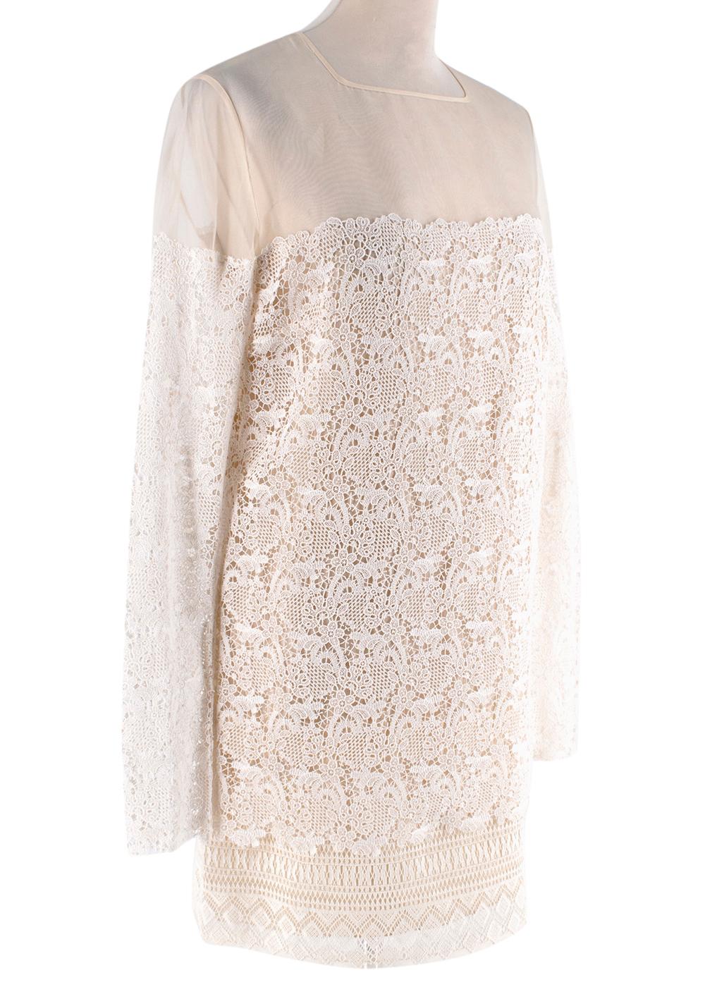 Ermanno Scervino Ivory Lace Dress 

- Sheer top 
- Long sleeved 
- Layered skirt
- Sheer underskirt 
- Petticoat
- Mid length 

Materials:
Exterior fabric:
- 100% Silk
Insert:
- 90% Cotton
- 10% Polyester
Lining:
- 100% Silk

Dry clean only

Made in