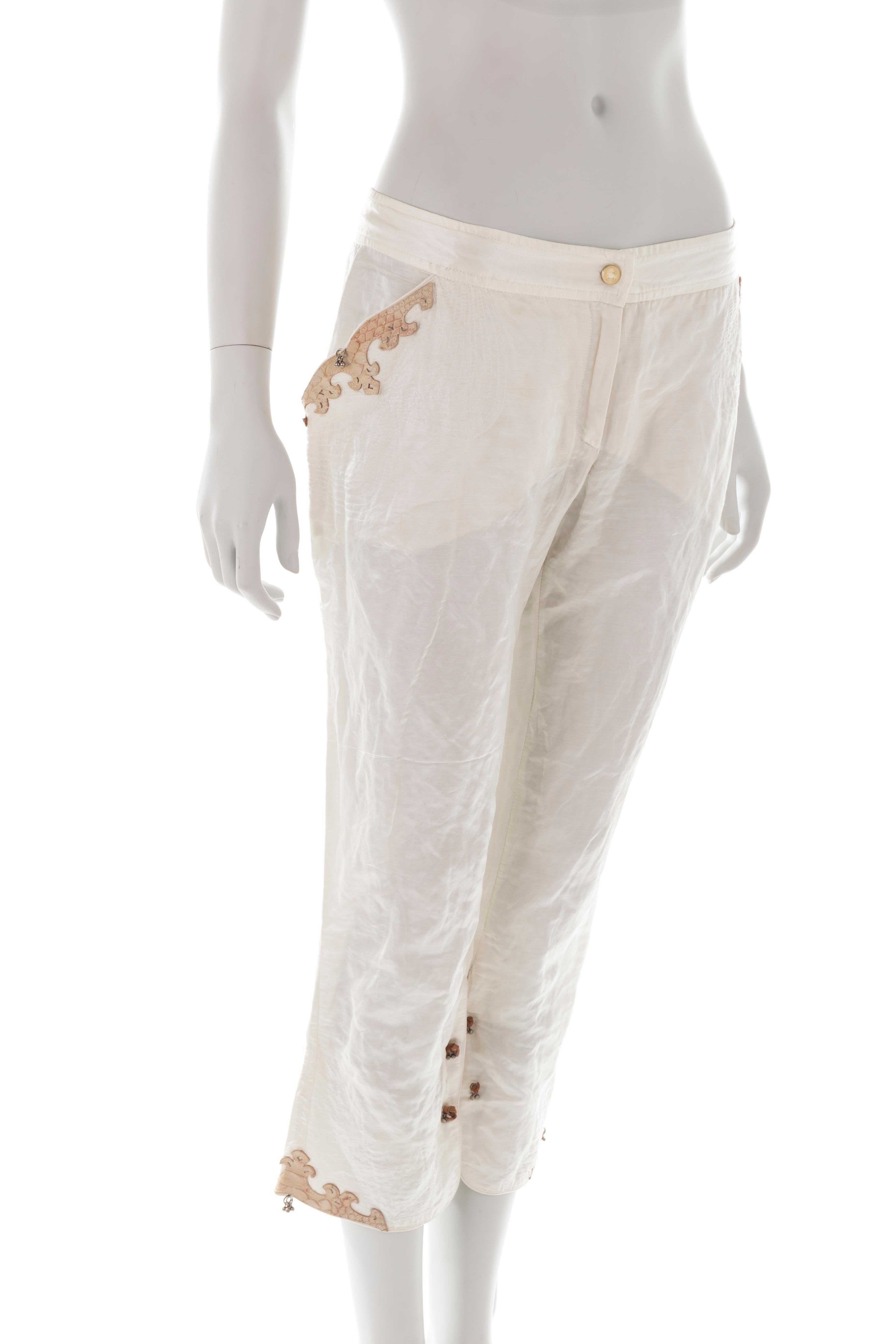 - Ermanno Scervino silk capri pants
- Sold by Gold Palms Vintage
- Mid 2000s
- Python leather appliques 
- Hook cuffs
- Size 44
- The garment has been pinned on the waist and hips to fit the mannequin
