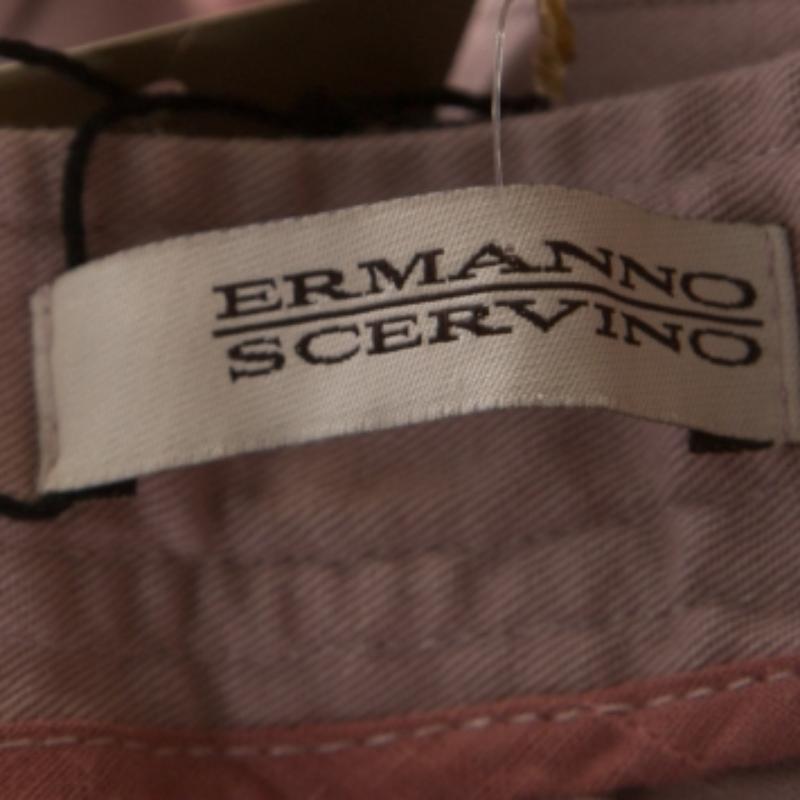 Cut from a cotton blend, these Ermanno Scervino trousers, carrying a lavender hue, are your go-to piece for any outing. They are designed with zip detailing and a fine fit. Team them with a printed top and ballet flats for a relaxed look.