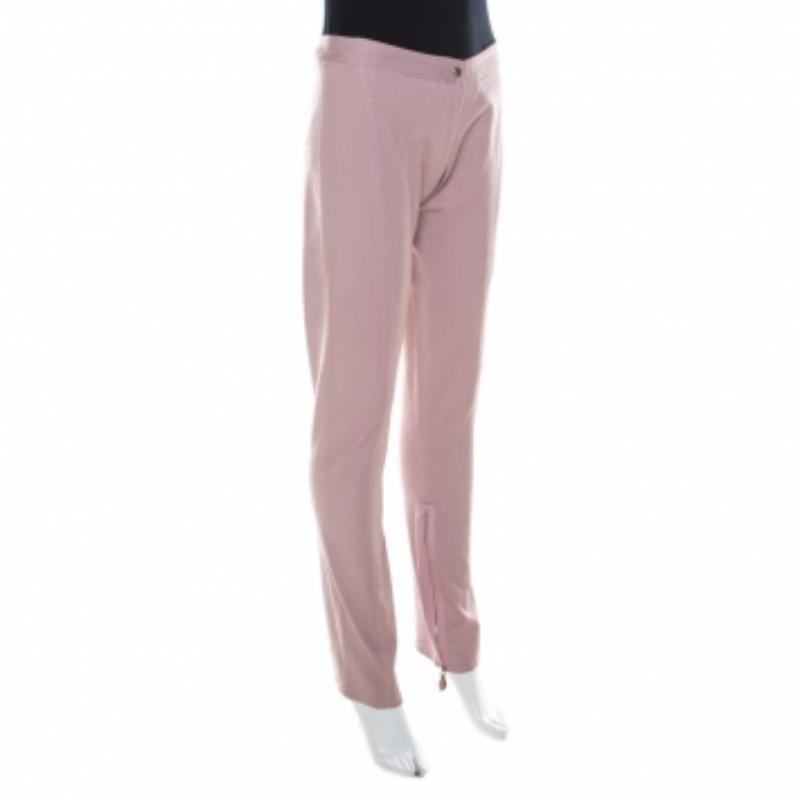 Cut from a cotton blend, these Ermanno Scervino trousers, carrying a lavender hue, are your go-to piece for any outing. They are designed with zip detailing and a fine fit. Team them with a printed top and ballet flats for a relaxed look.