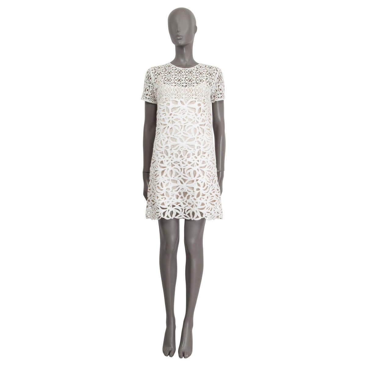 100% authentic Ermanno Scervino short sleeve dress in off-white nylon (100%). Embellished with crochet all over the dress. Opens with a concealed zipper on the back. Unlined. Comes with an off-white polyester (100%) slip dress. Has been worn and is