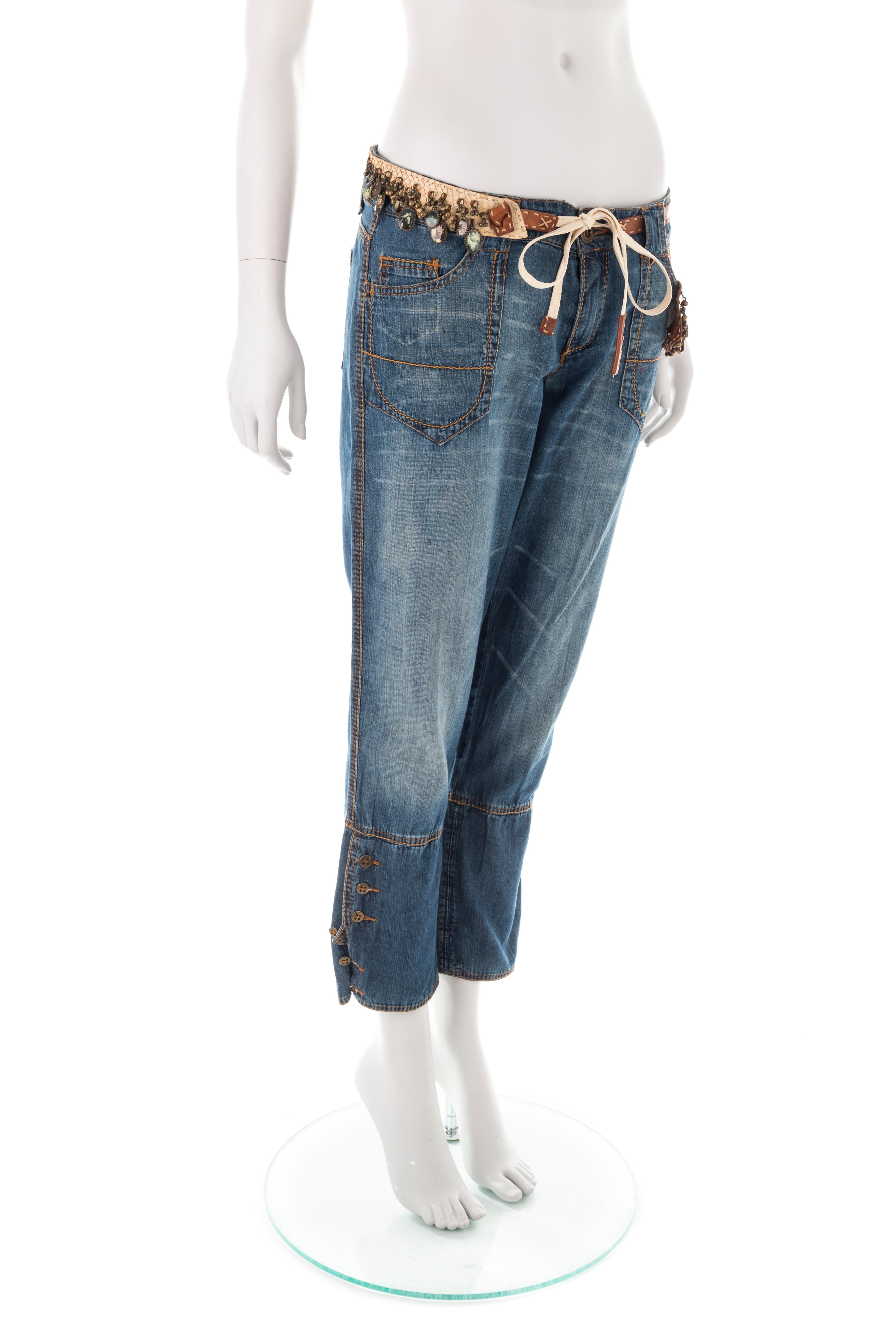 - Ermanno Scervino medium-wash whiskered capri jeans
- Sold by Gold Palms Vintage
- Spring/Summer 2005
- Cream cloth drawstring
- Python leather patches 
- Audrey Hepburn belt charms
- Button-up cuffs
- Size IT 44
- The garment has been pinned on