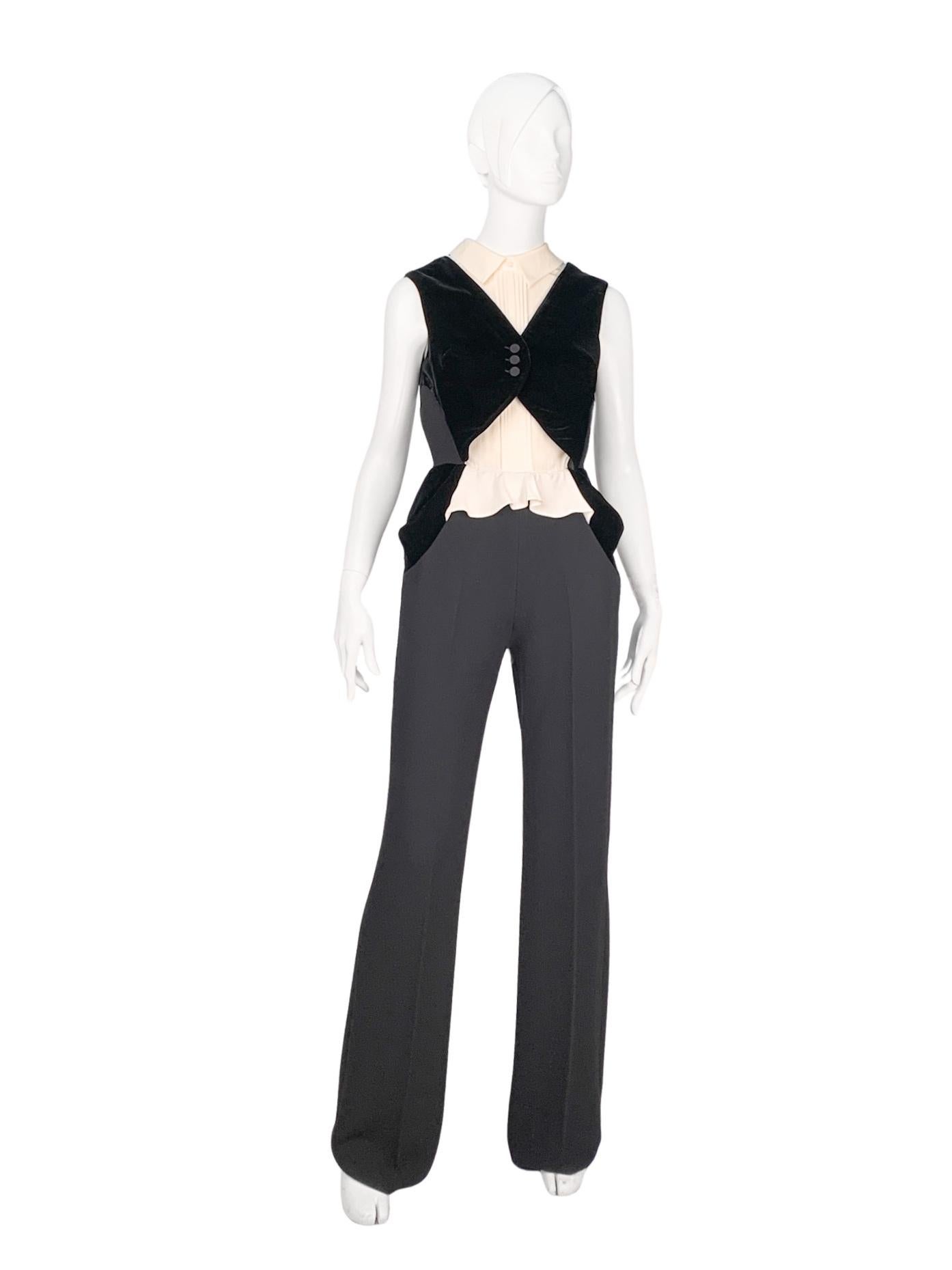 New with tags Ermanno Scervino long jumpsuit in off-white silk and black wool. Designed to visually elongate the legs and narrow the waist, it is adorned with ruffles and decorative pleats at the top and features a high-waisted, wide-leg silhouette
