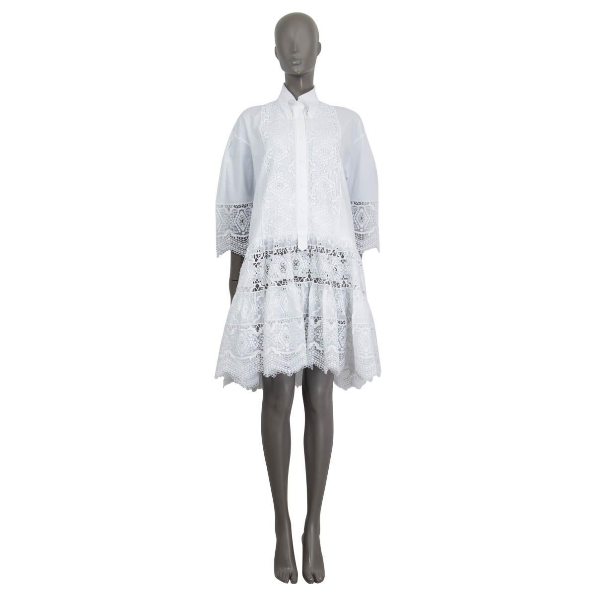 100% authentic Ermanno Scervino button down shirt in white cotton (80%) and polyester (20%). Features 3/4 sleeves and is embellished with broderie anglaise. Opens with six buttons on the front. Lined in white cotton (100%). Has some faint yellow