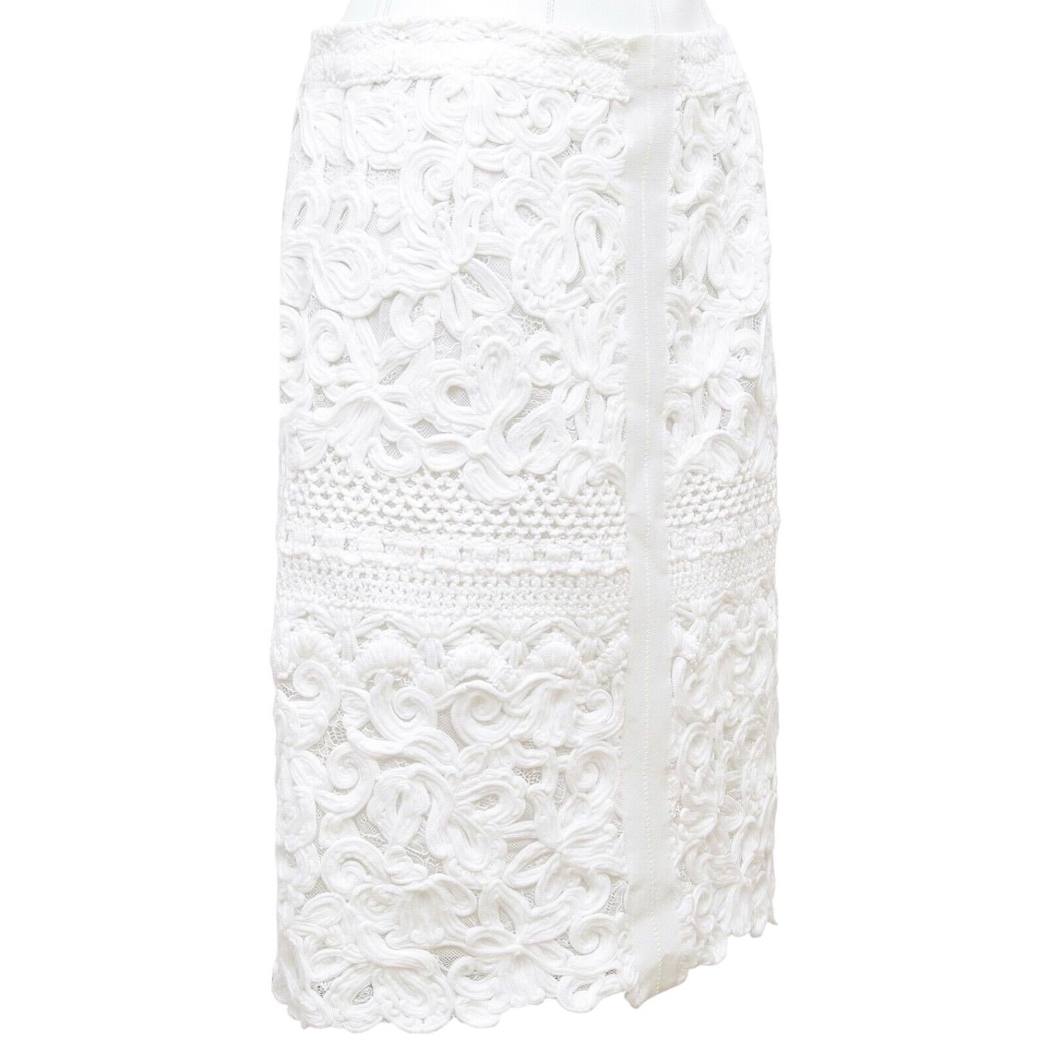 GUARANTEED AUTHENTIC ERMANNO SCERVINO WHITE FLORAL LACE SKIRT

Retail excluding sales taxes $1,665

Design:
- Medium weight viscose blend floral lace pencil skirt.
- Grosgrain down center front and back.
- Rear zipper closure.
- Lined.

Fabric: 65%