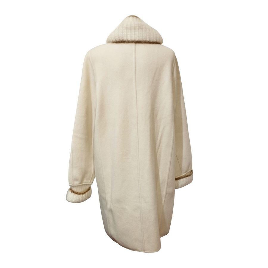 Wool (57%), angora and nylon Ivory color Mohair wool on collar and wrists Satin golden buttons Two pockets Shoulder/hem cm 90 (35,4 inches) Shoulder cm 42 (16,5 inches) Original price euro 1860