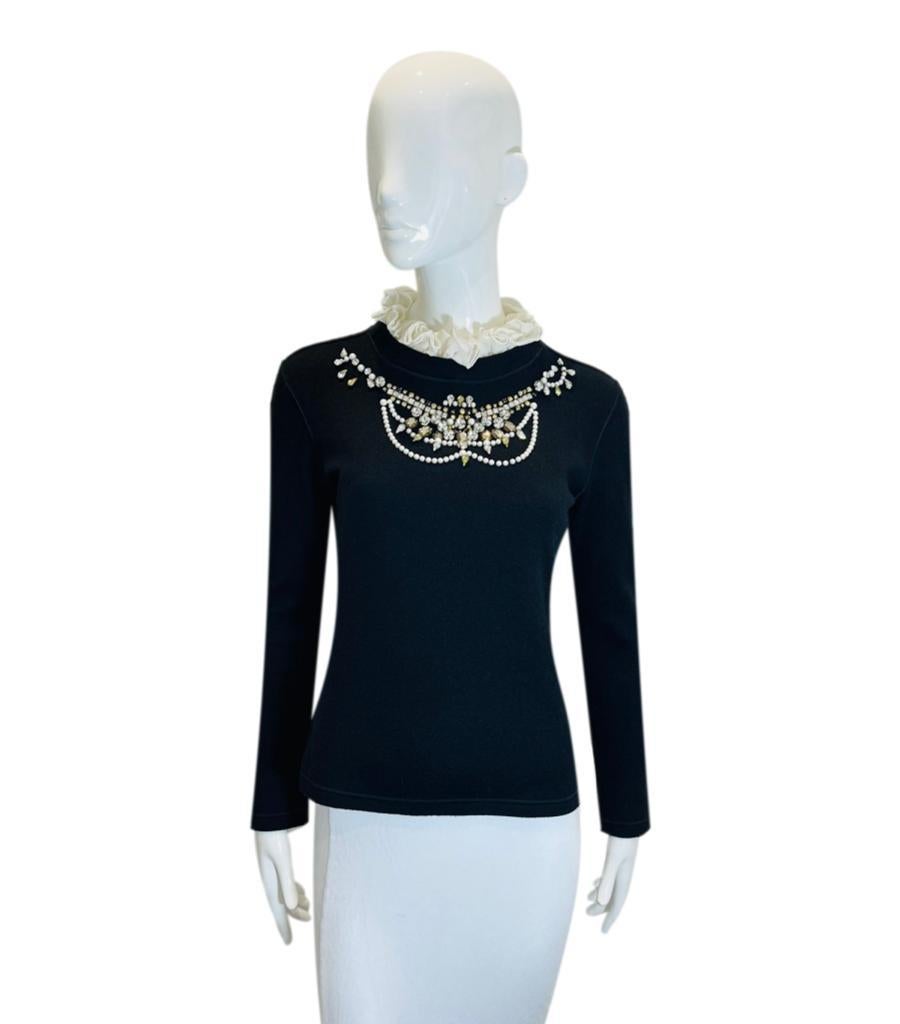 Ermanno Scervino Wool, Silk & Cashmere Crystal Neckline Jumper

Black jumper designed with crystal embellishment to the neckline and detailed with white ruffle, detachable collar.

Featuring long sleeves and fitted silhouette.

Size –