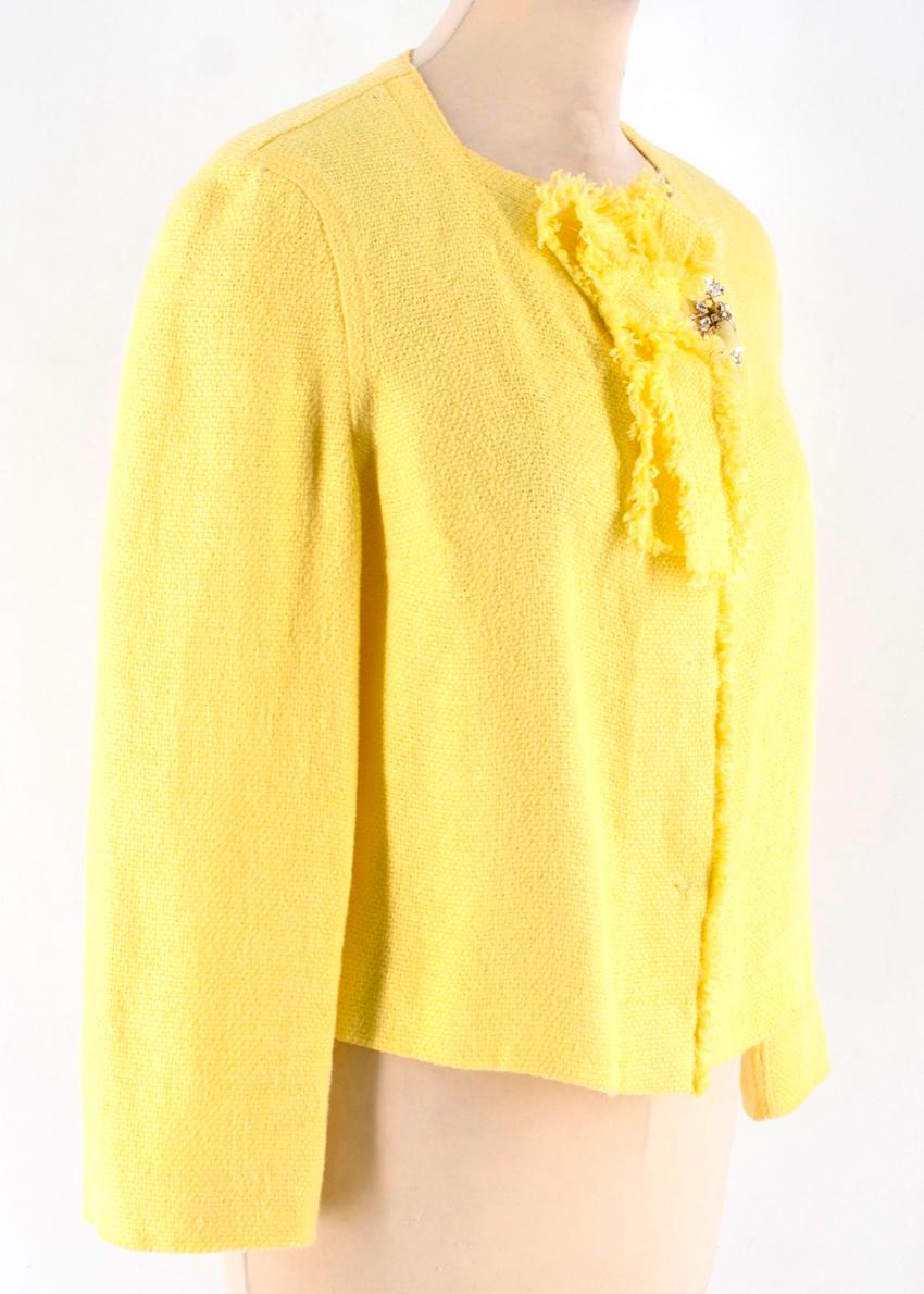 Ermanno Scervino Yellow Cropped Linen Jacket. Features a crystal brooch, and bow collar. 

- 94% Linen, 6% Polyamide
- Lining: 60% Acetate, 40% Cupro
- Made in Italy

Please note, these items are pre-owned and may show signs of being stored even