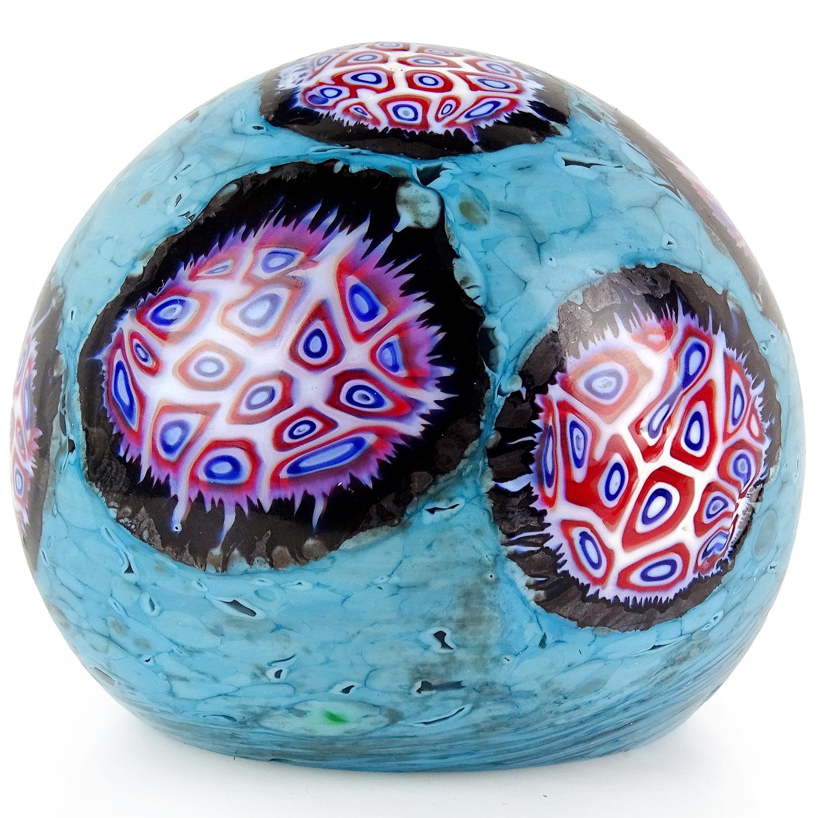 Beautiful vintage Murano hand blown white, blue, red mosaic Italian art glass paperweight. Documented to designer Ermanno Toso, for the Fratelli Toso Company. Created in the 