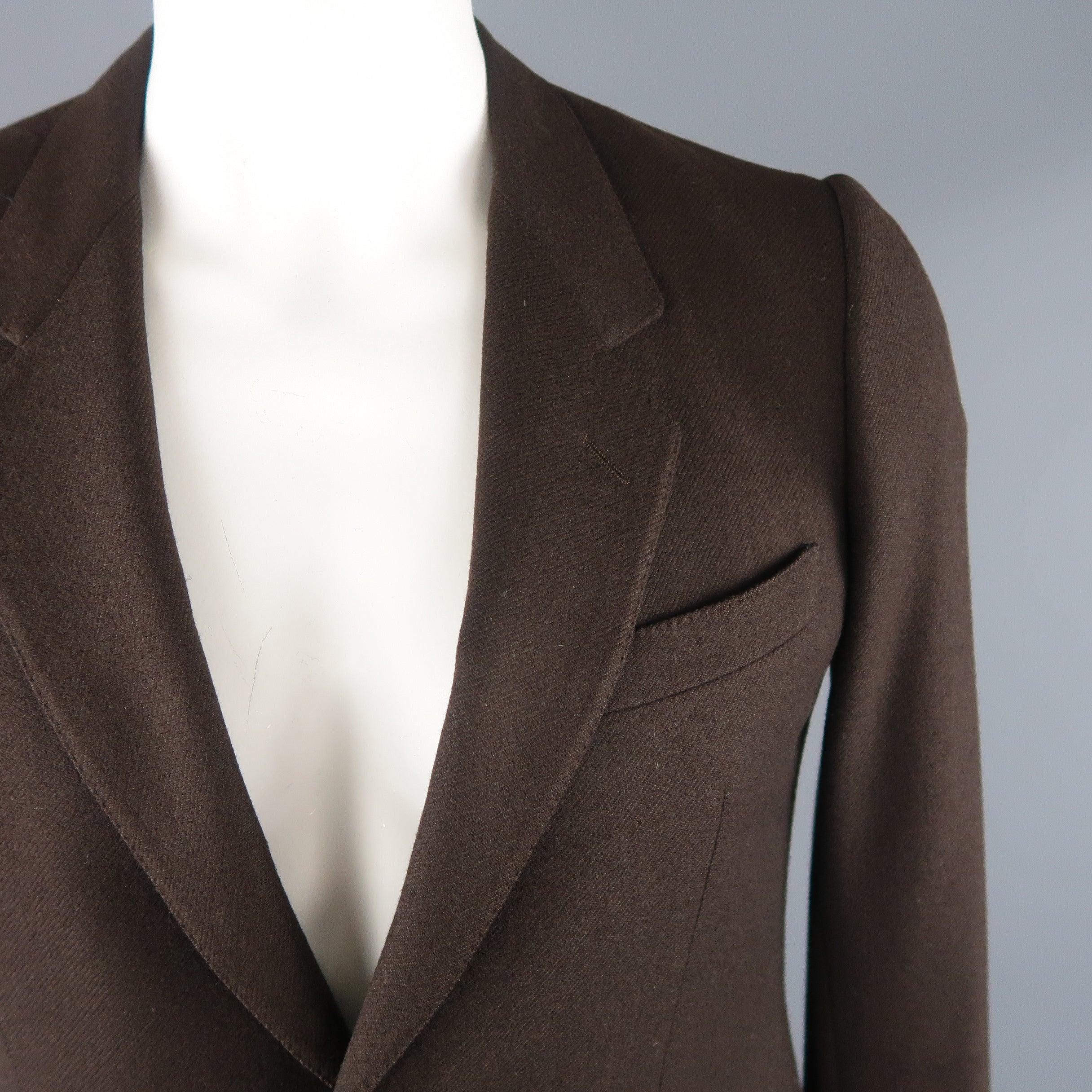 ERMENEGILDO ZEGNA classic sport coat comes in a brown tone in a solid wool / cashmere material, with a notch lapel, slit and flap pockets, 2 buttons closure, single breasted with a single vent at back. Very light discoloration at lining. Made in