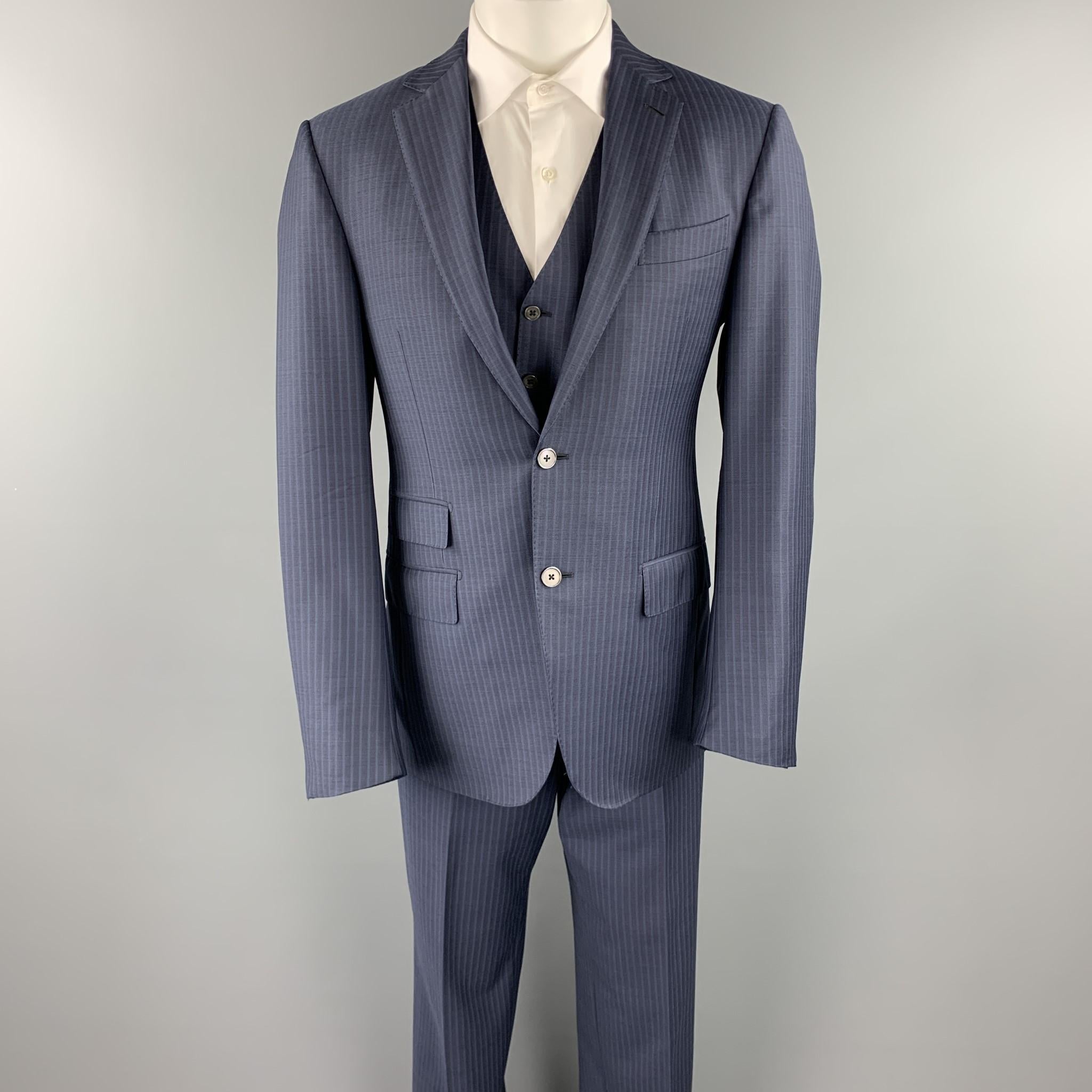 ERMENEGILDO ZEGNA 3 Piece suit comes in a navy stripe wool and includes a single breasted, two button sport coat with a notch lapel and pleated front trousers. Made to measure. Made in Switzerland.

Excellent Pre-Owned Condition.
Marked: 50