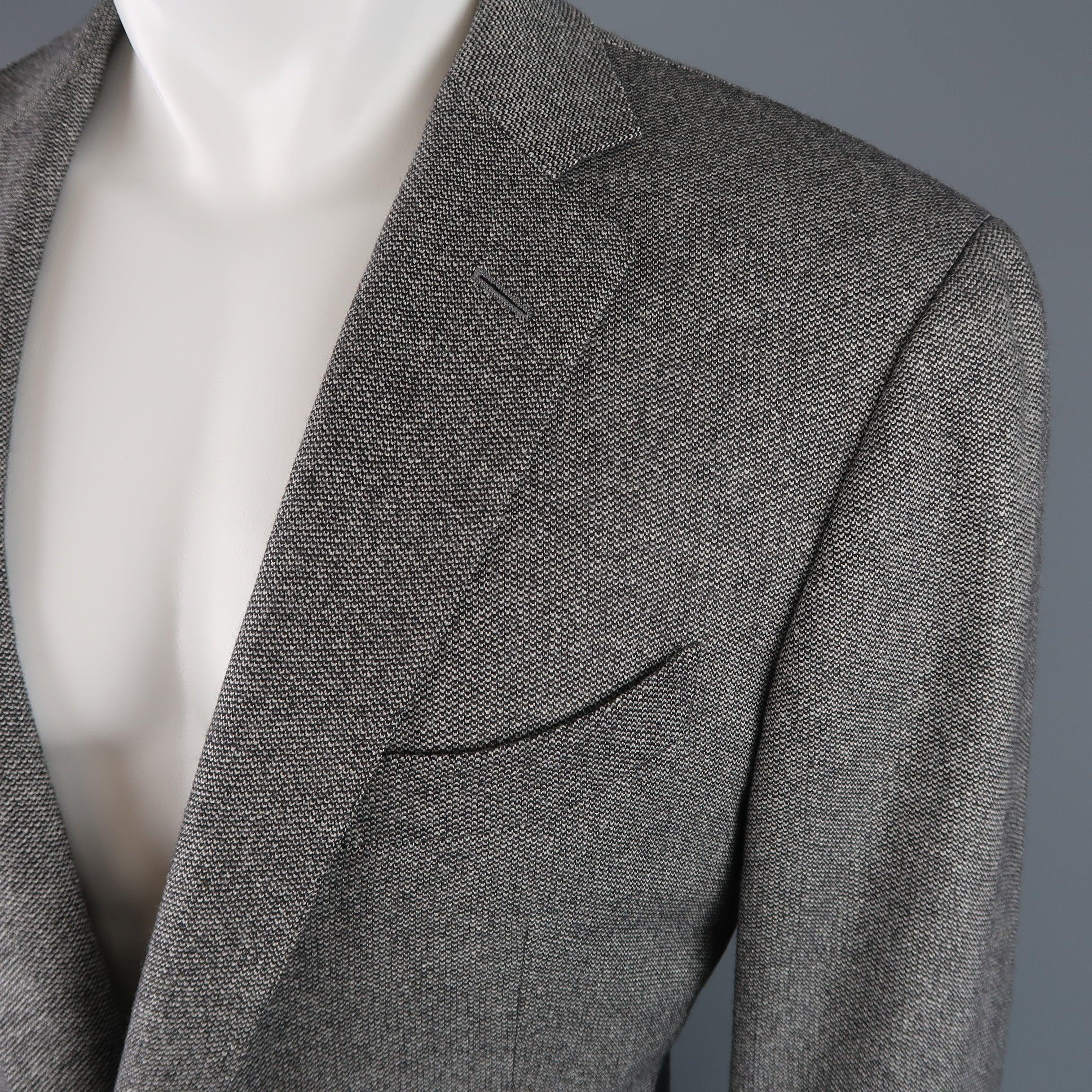 Single breasted ERMENEGILDO ZEGNA sport coat comes in gray heathered wool cashmere with a notch lapel, two button front, and double vented back. Cracks in front buttons. As-is. Made in Italy.Good Pre-Owned Condition. 

Marked:   IT 54