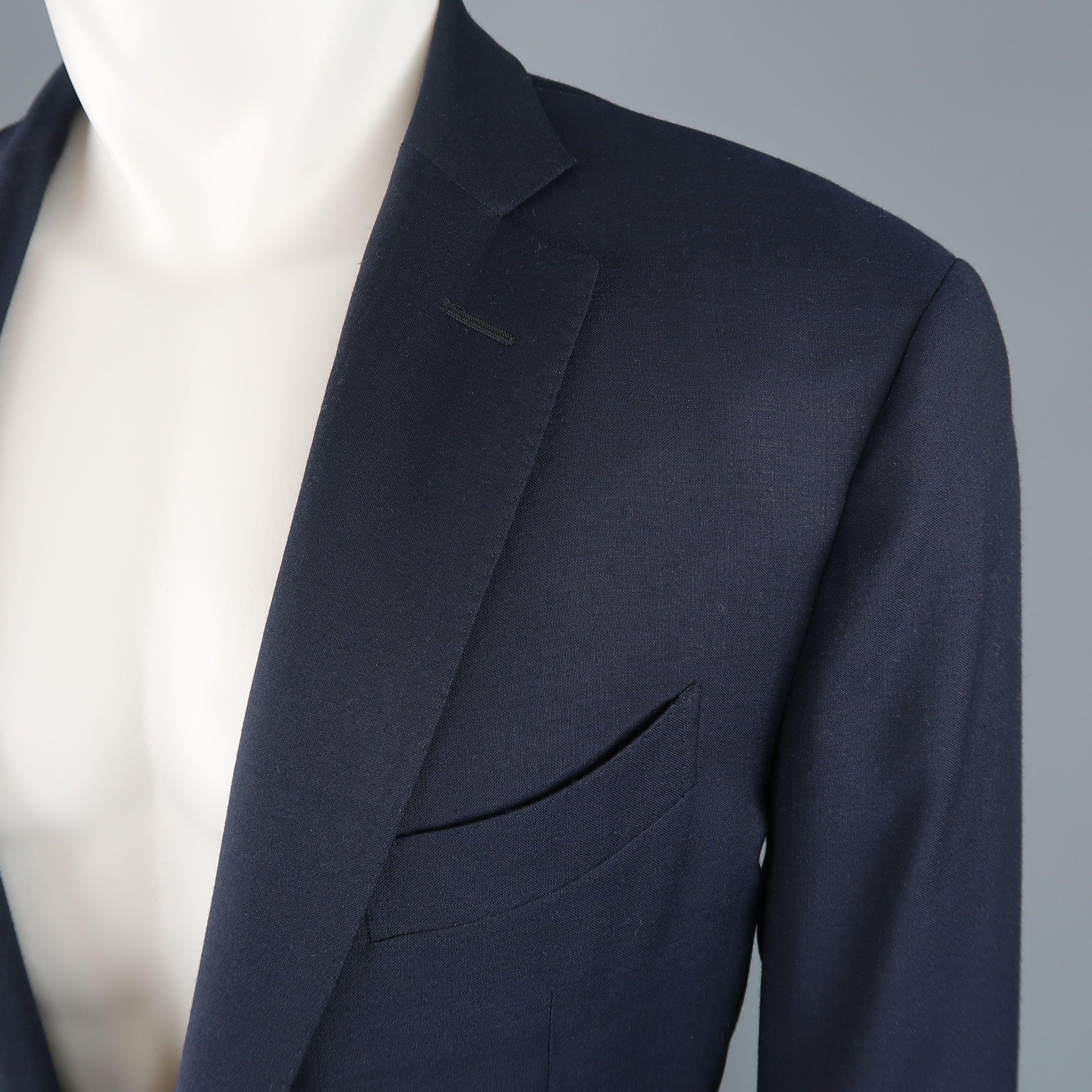 Single breasted ERMENEGILDO ZEGNA sport coat comes in navy wool with a notch lapel, two button front, glenplaid liner, and top stitching throughout. Made in Italy.
 Good Pre-Owned Condition.
  
 

 Marked:  IT 54
  
 

 Measurements: 
  
 l