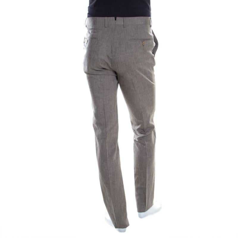 Trousers are an essential wardrobe staple and these tailored ones from Ermenegildo Zegna are sure to be an amazing addition to your collection! The beige trousers are made of a silk and linen blend and feature a slim fit silhouette. They come