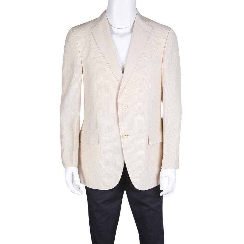 Your blazer is a very integral part of your formal attire and nothing says professional like a well fit coat. Ermenegildo Zegna Beige Pinstriped Linen Blend Regular Fit Blazer is a very stylish layer over your shirt. It can also be paired with a