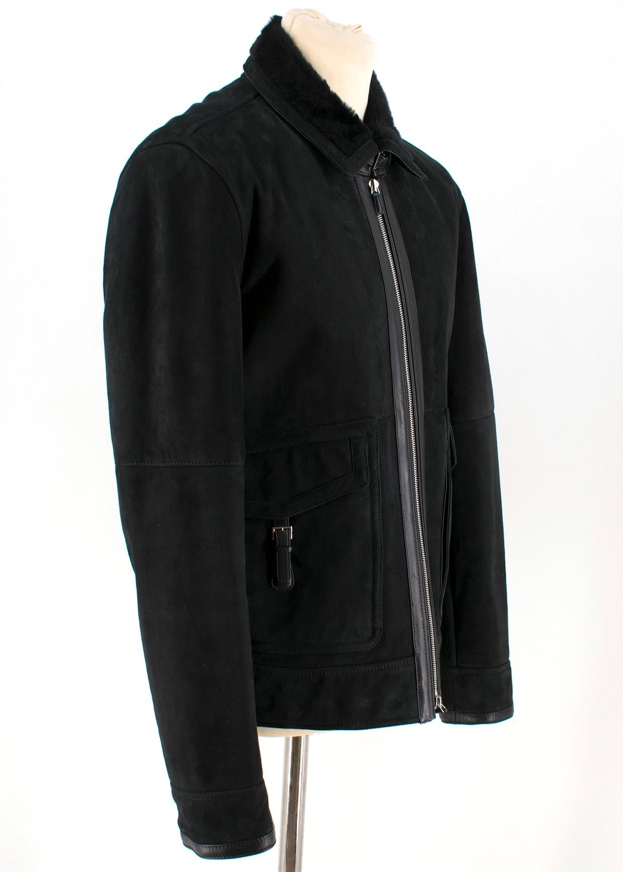 Ermenegildo Zegna black shearling jacket

- Fur lapel with a buckle
- Zip closure 
- 2 front flapped pockets with buckles
- Fur linings
- One zipped inside pocket

Please note, these items are pre-owned and may show some signs of storage, even when