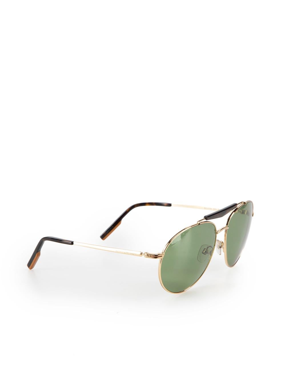 CONDITION is Very good. Hardly any visible wear to sunglasses is evident on this used Ermenegildo Zegna designer resale item. This item comes with original case.



Details


Brown

Metal

Aviator sunglasses

Tortoiseshell accent

Tinted green