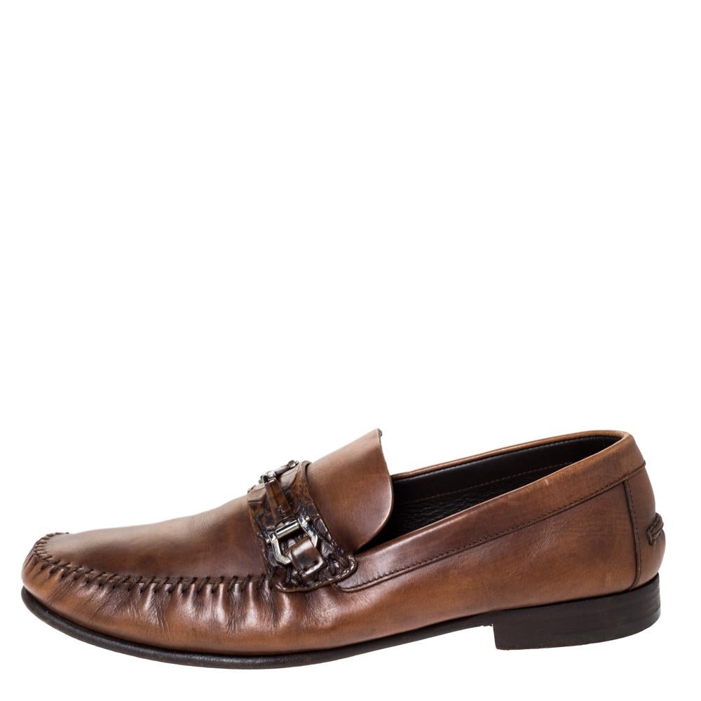 These loafers from Ermenegildo Zegna will add a grand touch to your formal style. They are crafted from brown leather and designed with Horsebits on the uppers in silver-tone hardware and leather insoles. You will surely receive comfort and ease