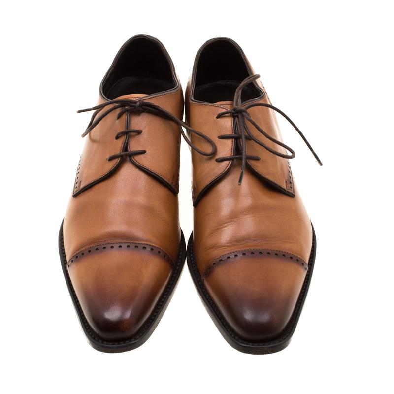 Take each step with style in these derby oxfords from Ermenegildo Zegna. Crafted from leather, they carry a modern design with a smart brown exterior that flaunts neat stitch detailing and lace-up fronts. The leather-lined insoles provide comfort