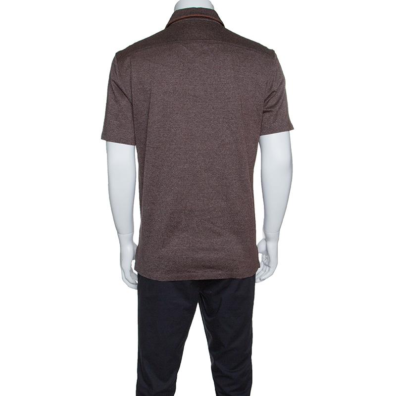 This Ermenegildo Zegna Polo T-Shirt is here to take your casual style a notch higher. It is made from marled cotton and designed in a brown shade with short sleeves, a collar and front buttons.

Includes: The Luxury Closet Packaging

