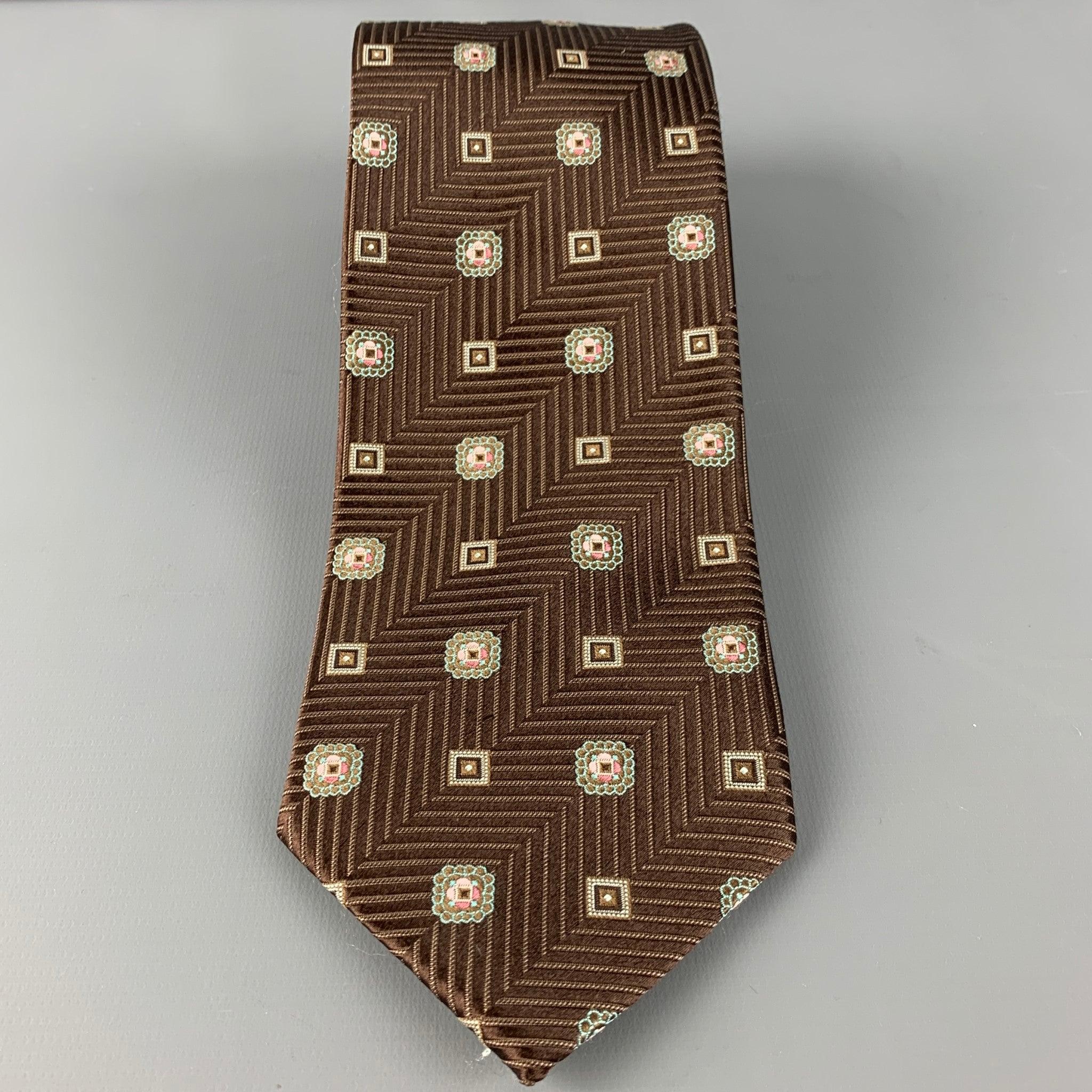 ERMENEGILDO ZEGNA tie in a brown silk with a blue and tan abstract pattern on a chevron background.. Made in Italy.Very Good Pre-Owned Condition. 

Measurements: 
  Width: 3.5 inches Length: 60 inches 
  
  
 
Reference: 126568
Category: Tie
More