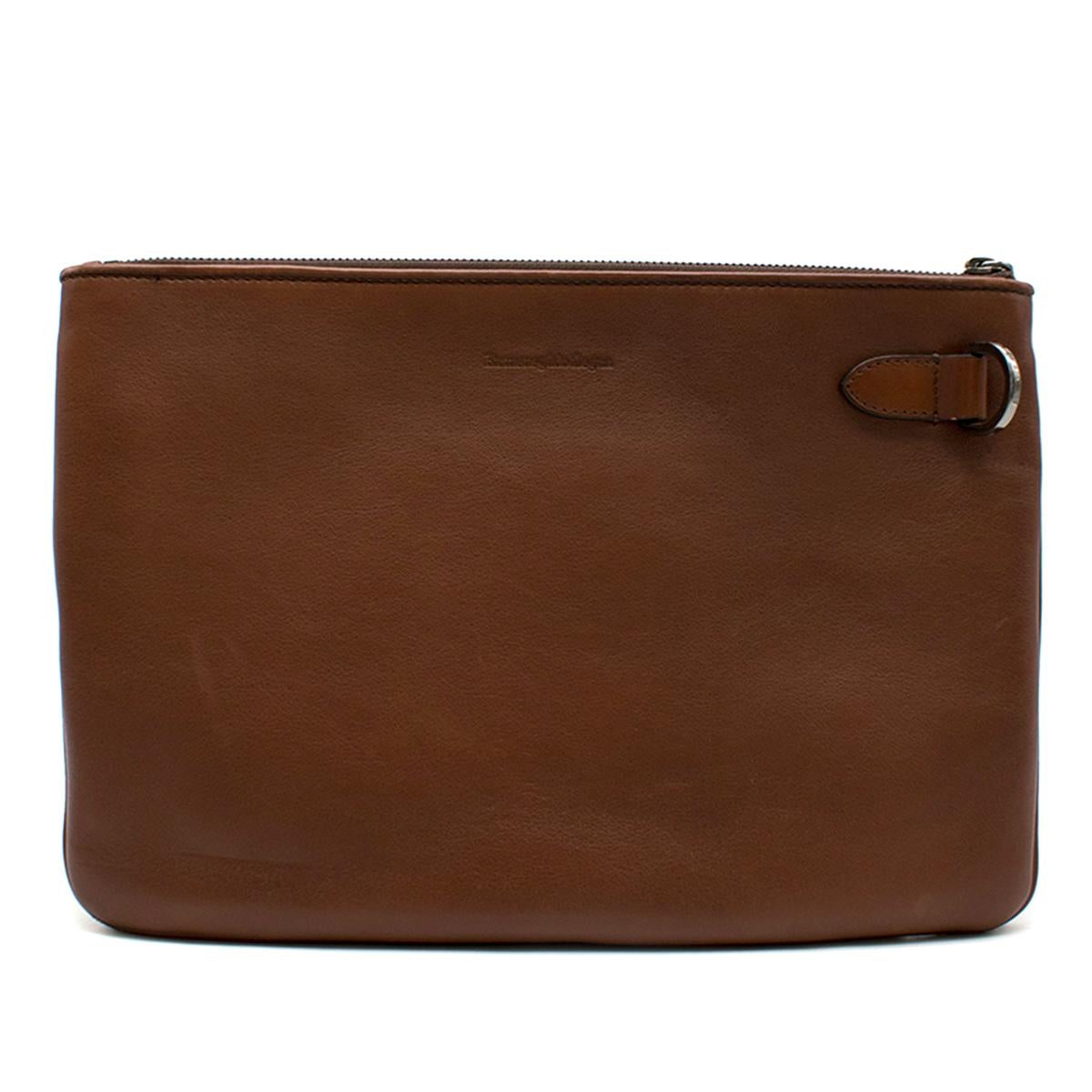 Ermenegildo Zegna Brown Woven Leather Pouch 

- Brown Pouch Case 
- Handwoven leather back panel
- Embossed logo on smooth panel 
- Zip fastening closure at top
- Suede lining, dual slip pockets

This item comes with a dust bag. 

Please note, these
