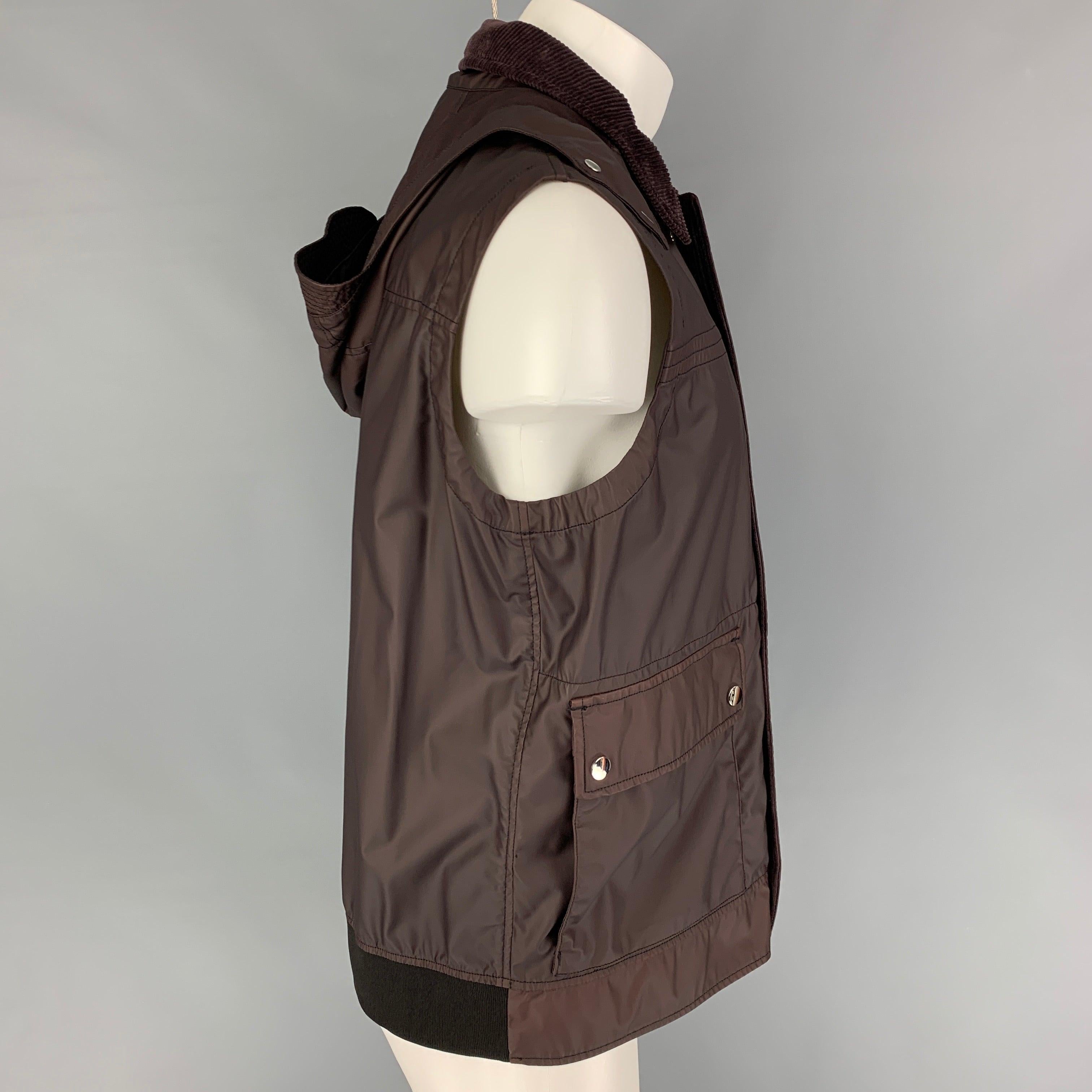 ERMENEGILDO ZEGNA vest comes in burgundy coated wool with a corduroy collar, zip front with hidden snap placket, flap pockets, and detachable hood. Made in Romania.New with Tags.  

Marked:   
IT 50 

Measurements: 
 
Shoulder: 18 inches Chest: 46