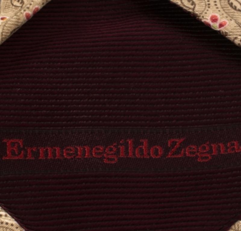 Why settle for a plain tie when you can add just the luxurious cut with this silk piece from Ermenegildo Zegna! The tie is splayed with a floral pattern which lends it a classic appeal. Make sure to pair the tie with your simple shirts for a