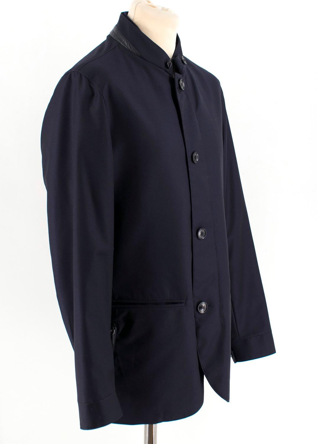 Ermenegildo Zegna elements navy blue wool jacket

details 100% leather;
inside part 100% virgin wool;
lining sleeves 100% polyester;
padding 100% polyester;
zip and button closure;
two front pockets;
two side pockets;

Please note, these items are