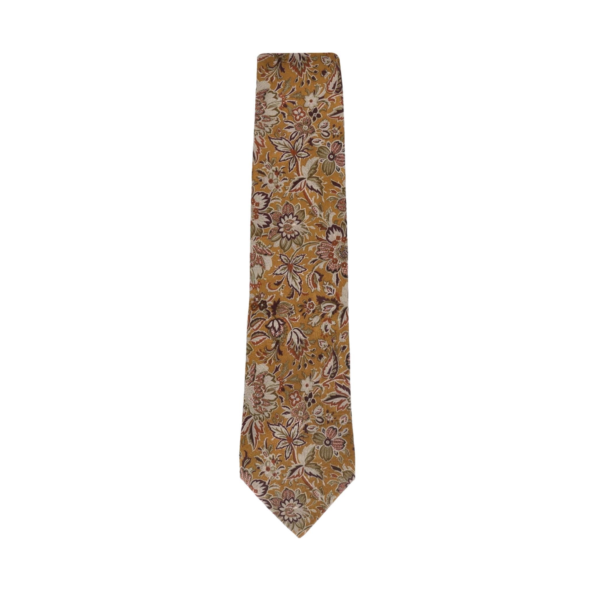 Ermenegildo Zegna Floral Silk Tie

Silk tie in a dark yellow colour with an all-over floral pattern in shades of green, burgundy, and orange.

Size - Length 147 cm

Condition - Very Good (Few threads are loose along the seam)

Composition - 100%
