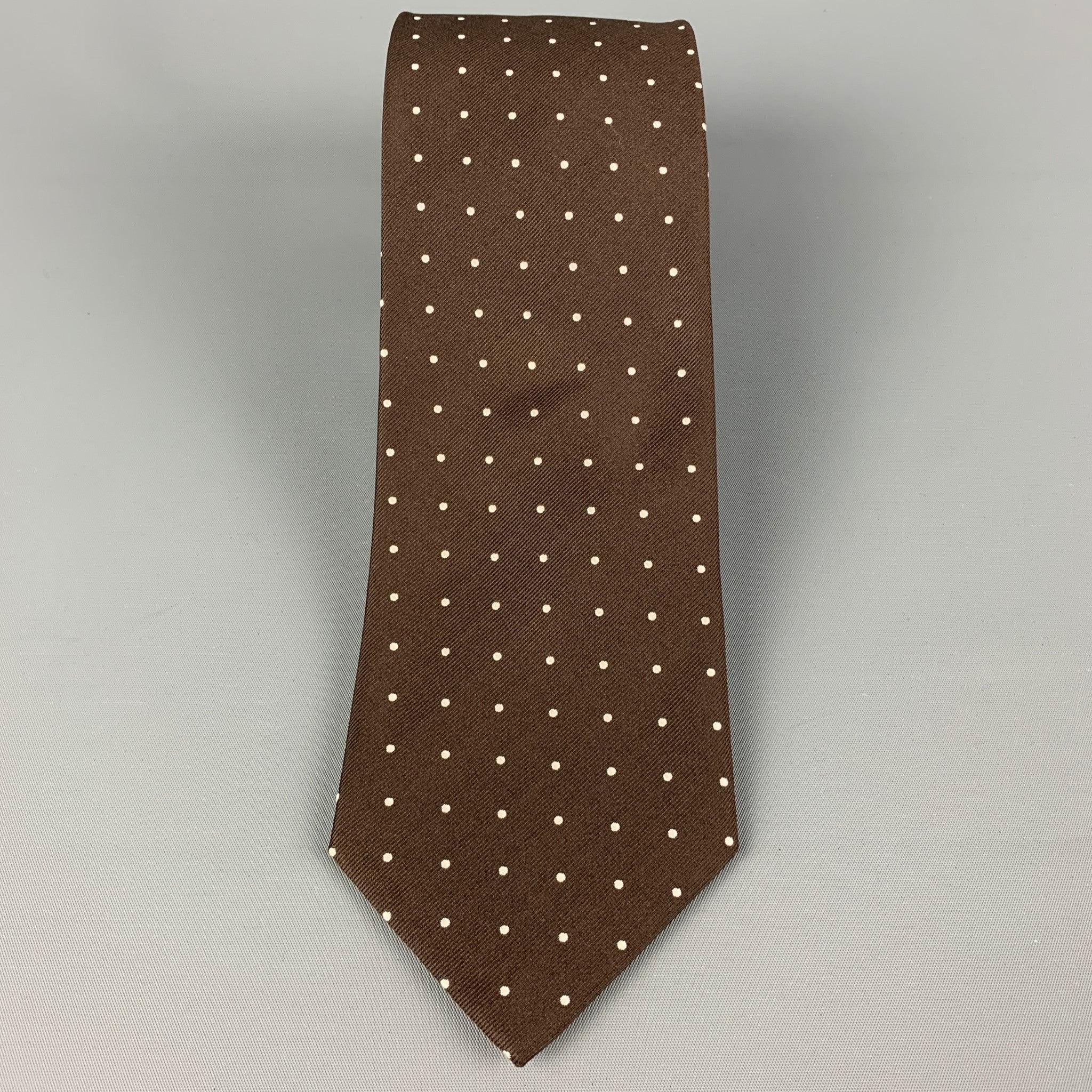 ERMENEGILDO ZEGNA for WILKES BASHFORD
 necktie comes in a brown & white silk with a all over polka dot print. Made in Italy . Very Good Pre-Owned Condition.Width: 3.5 inches Length: 58 inches 
  
  
  
 Sui Generis Reference: 120415
 Category: Tie
