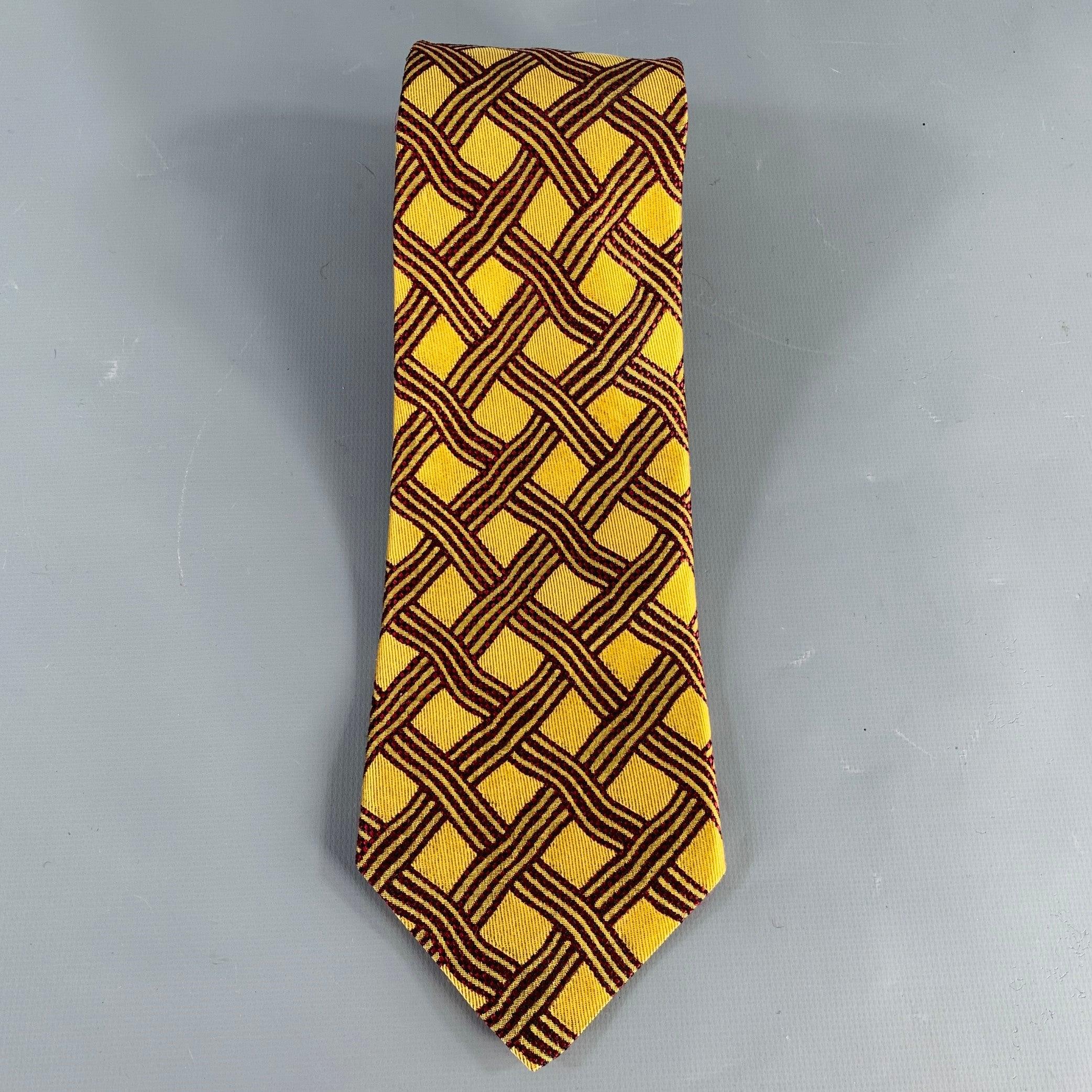 ERMENEGILDO ZEGNA for WILKES BASHFORD
necktie in a gold tone and burgundy silk jacquard featuring a woven pattern. Made in Italy.Excellent Pre-Owned Condition. 

Measurements: 
  Width: 3.75 inches Length: 58 inches 
  
  
 
Sui Generis Reference: