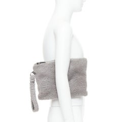 ERMENEGILDO ZEGNA grey lambskin shearling wrist strap zip clutch bag