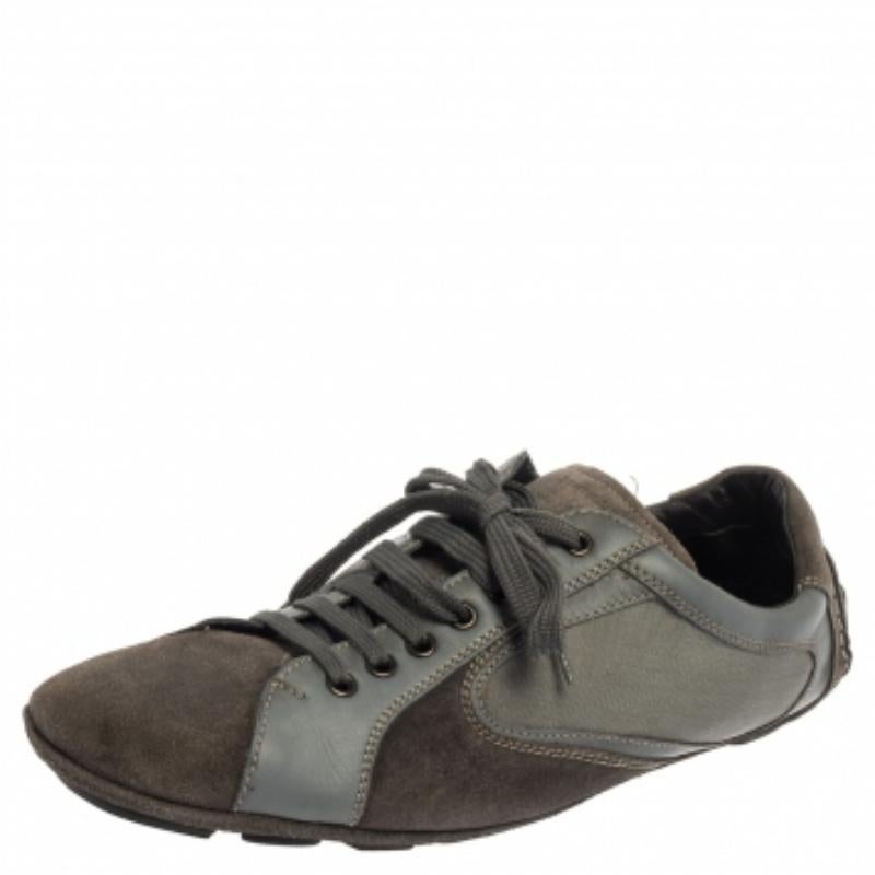 These fabulous sneakers from Ermenegildo Zegna are here to impress you with their effortless style! The grey sneakers have been crafted from leather and suede and styled with round toes, lace-ups on the vamps, and brand logo detailing on the