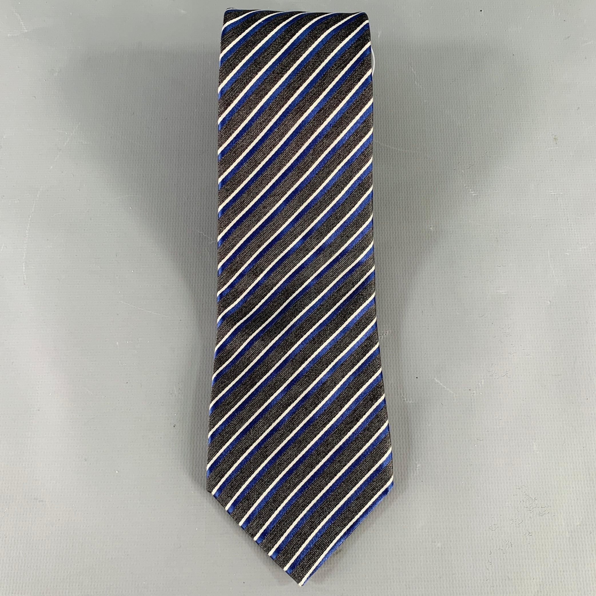 ERMENEGILDO ZEGNA necktie in a grey and navy silk featuring a diagonal stripe pattern. Made in Italy.Excellent Pre-Owned Condition. 

Measurements: 
  Width: 3.25 inches Length: 60 inches 

  
  
 
Sui Generis Reference: 134997
Category: Tie
More